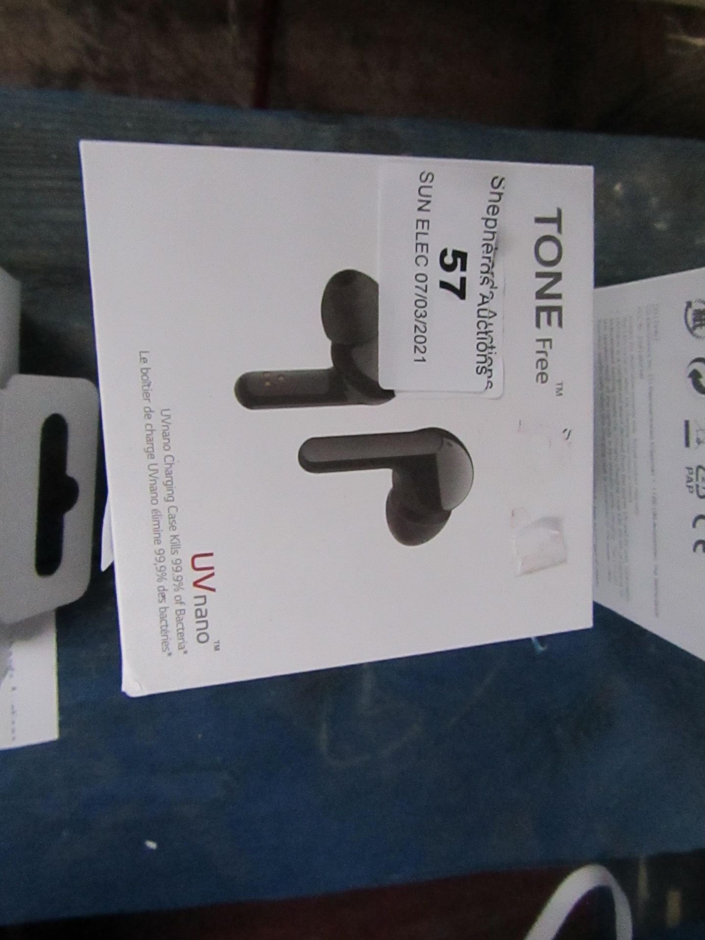 LG Tone Free Wireless earphones with charging case, unchecked as they have run out of charge, RRP £