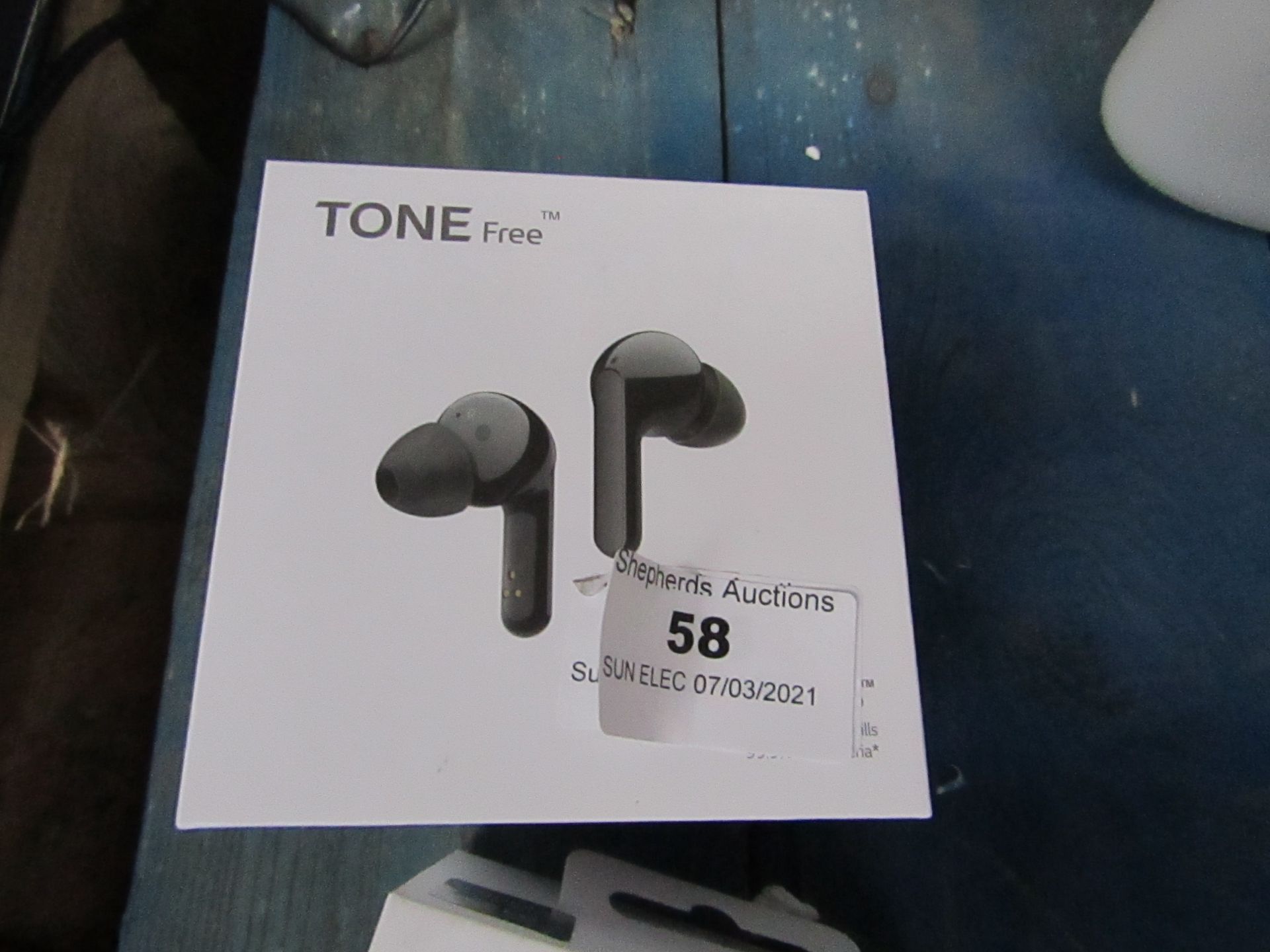 LG Tone Free Wireless earphones with charging case, unchecked as they have run out of charge, RRP £