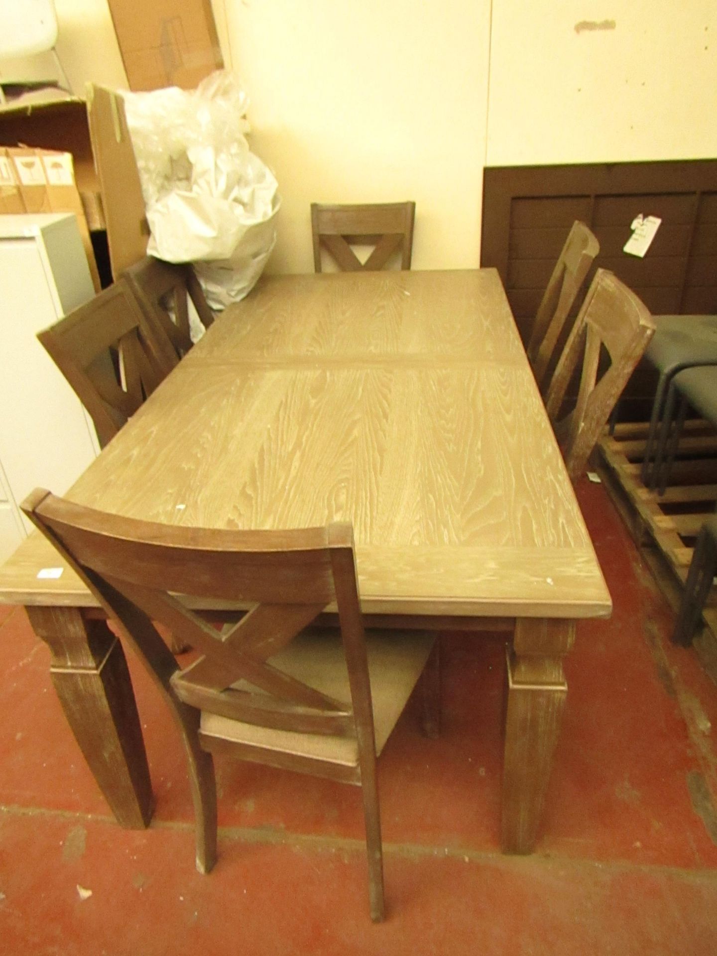 Costco extending dining table and 6 matching chairs, appears to be in good condition just a few