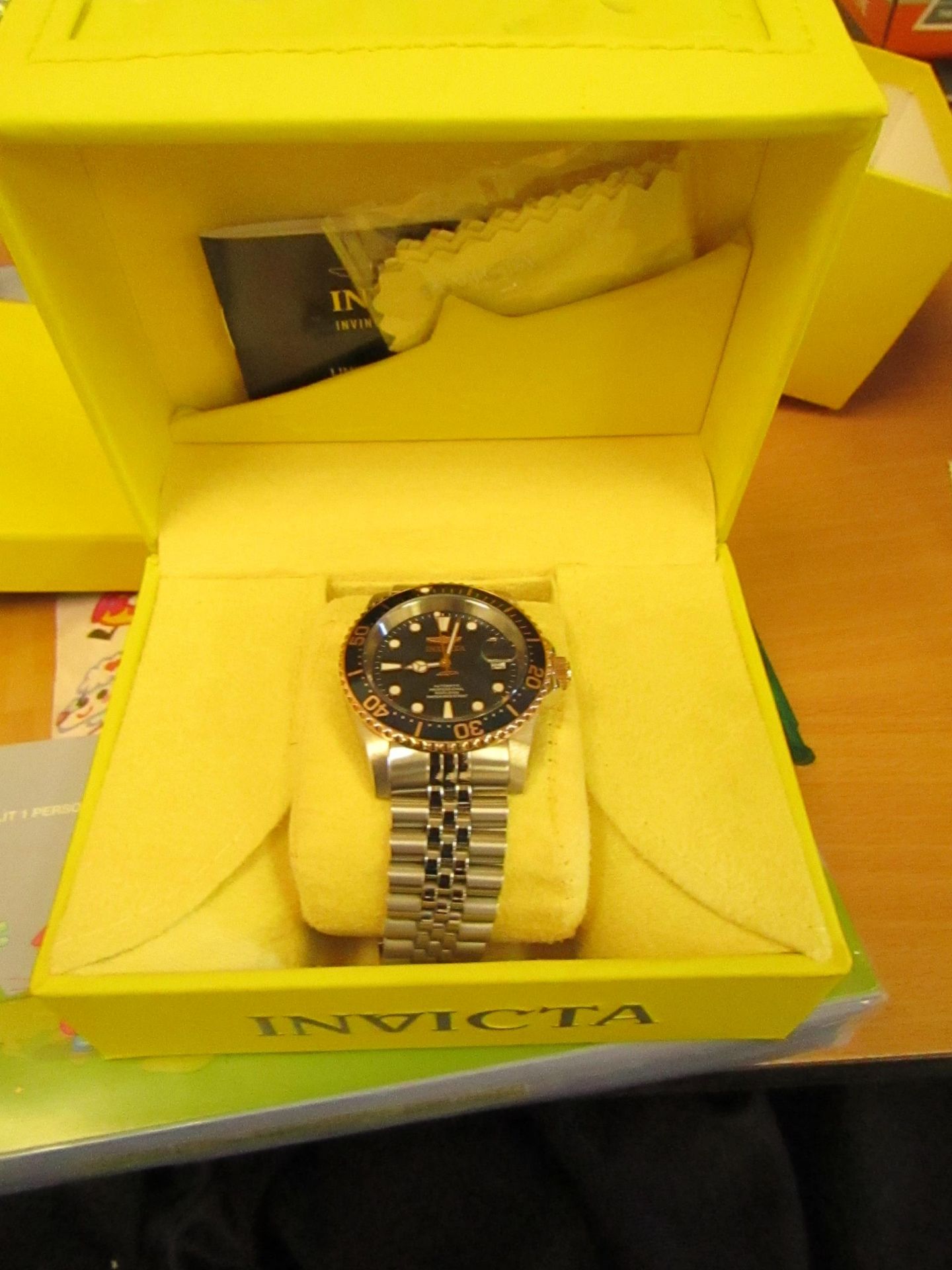 Invicta Silver and gold coloured Automatic watch, not ticking or winding but comes with original