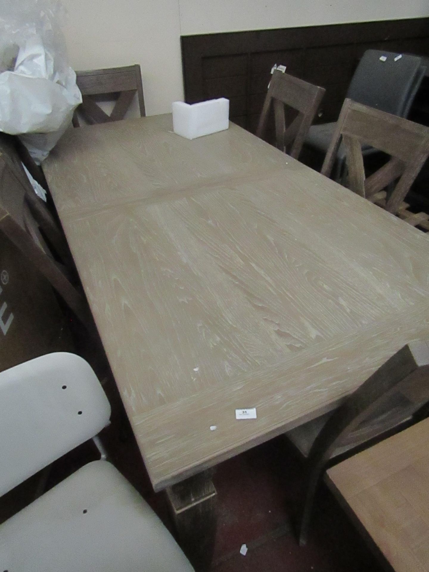 Costco extending dining table and 6 matching chairs, appears to be in good condition just a few