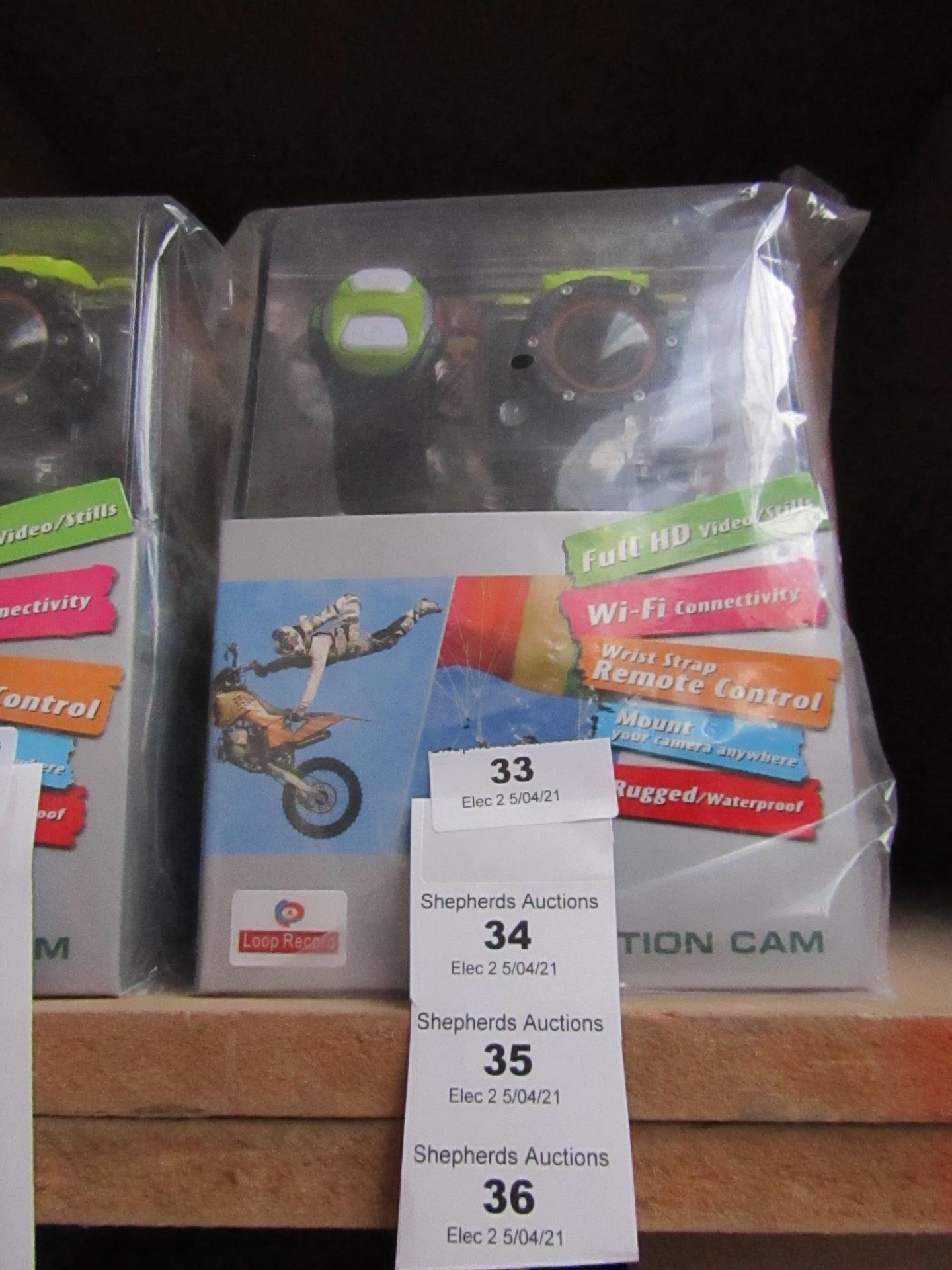 Action camera with various accessories AND REMOTE CONTROL WRIST STRAP, new and boxed.