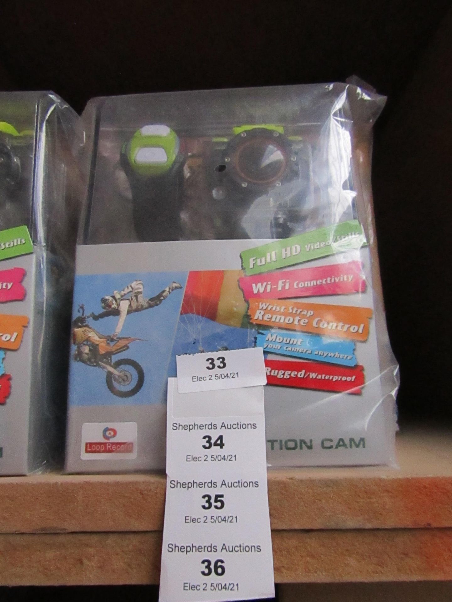 Action camera with various accessories AND REMOTE CONTROL WRIST STRAP, new and boxed.