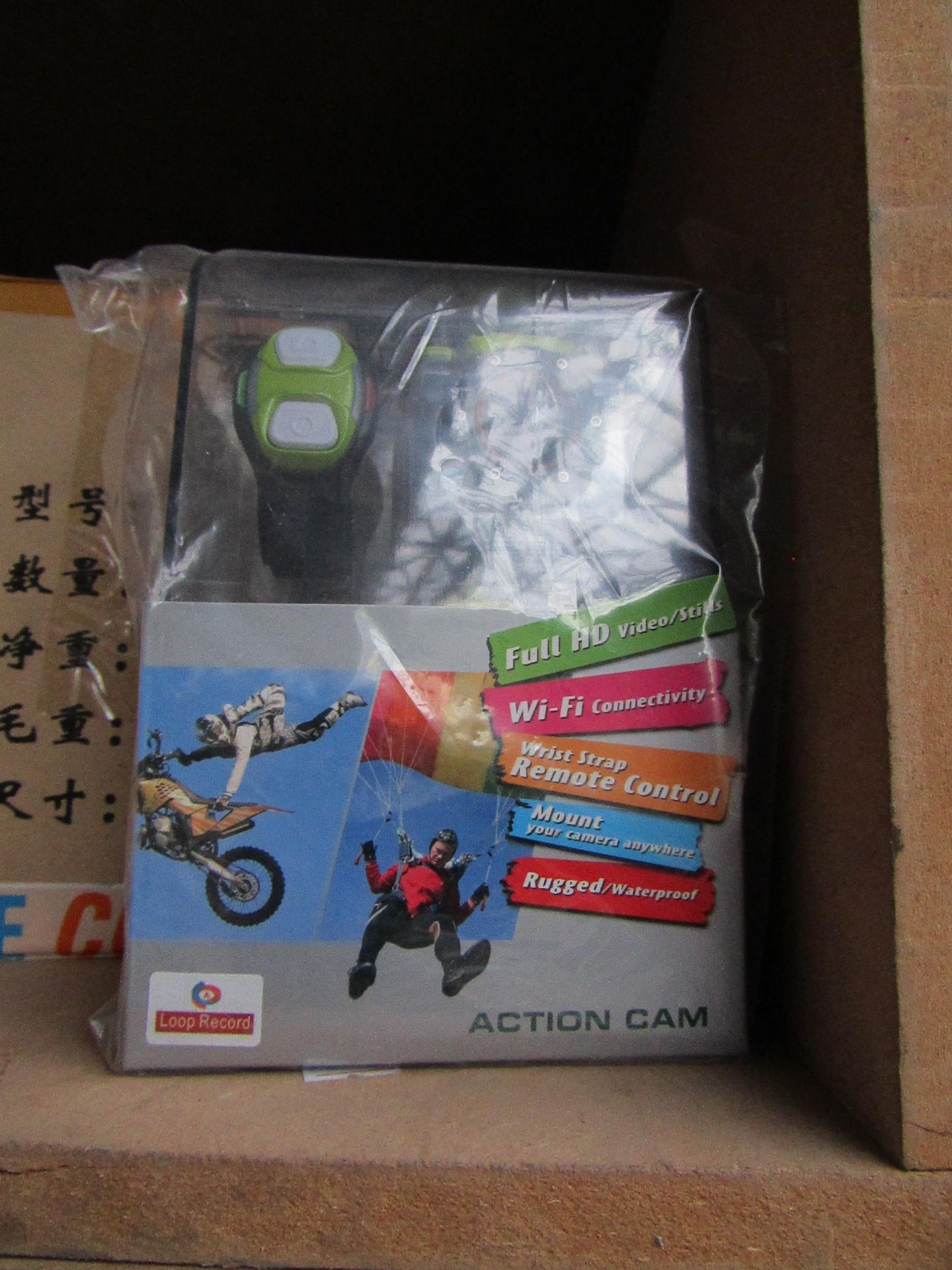 Action camera with various accessories AND REMOTE CONTROL WRIST STRAP, new and boxed.