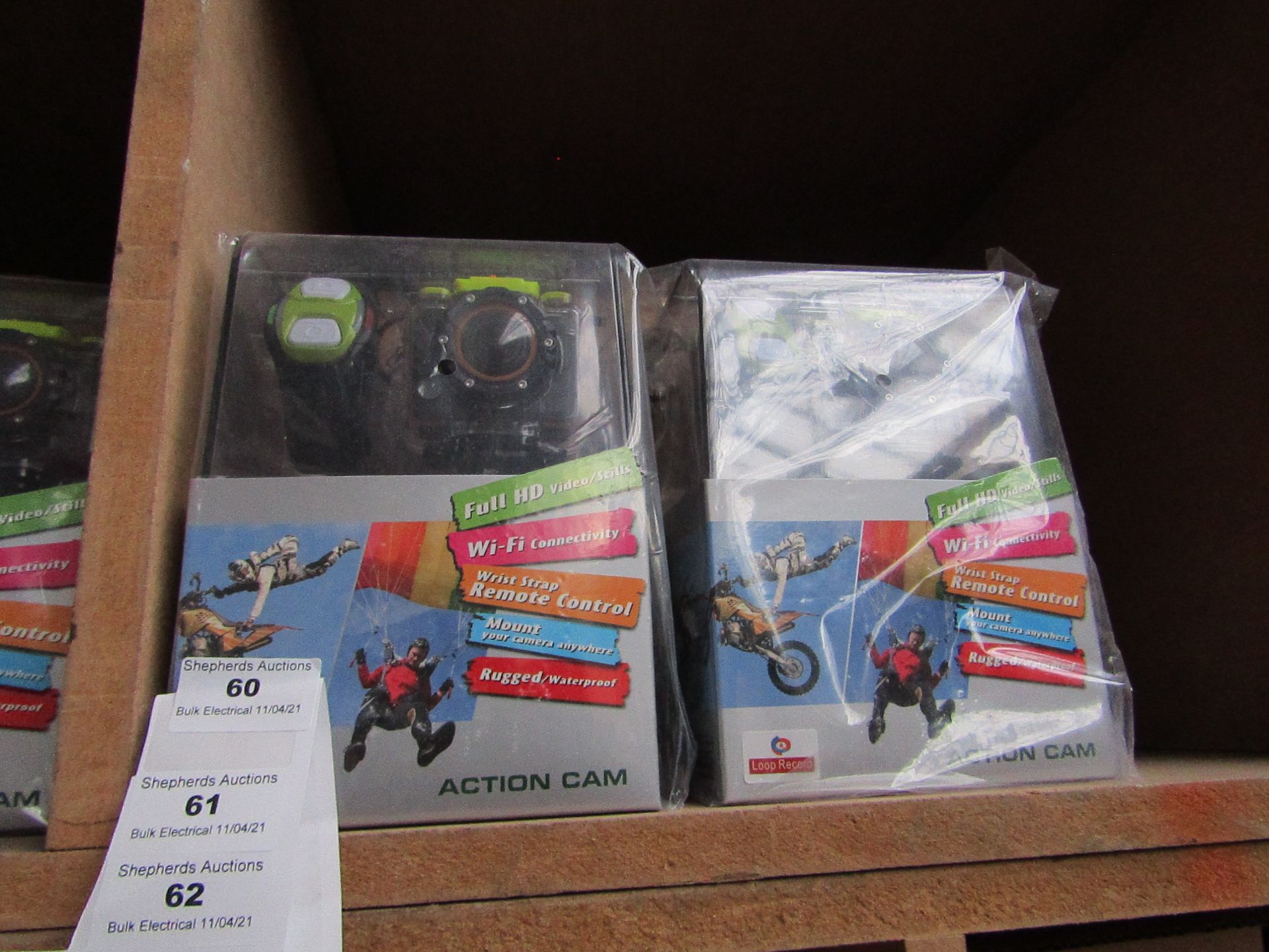 Action camera with various accessories AND REMOTE CONTROL WRIST STRAP, new and boxed.