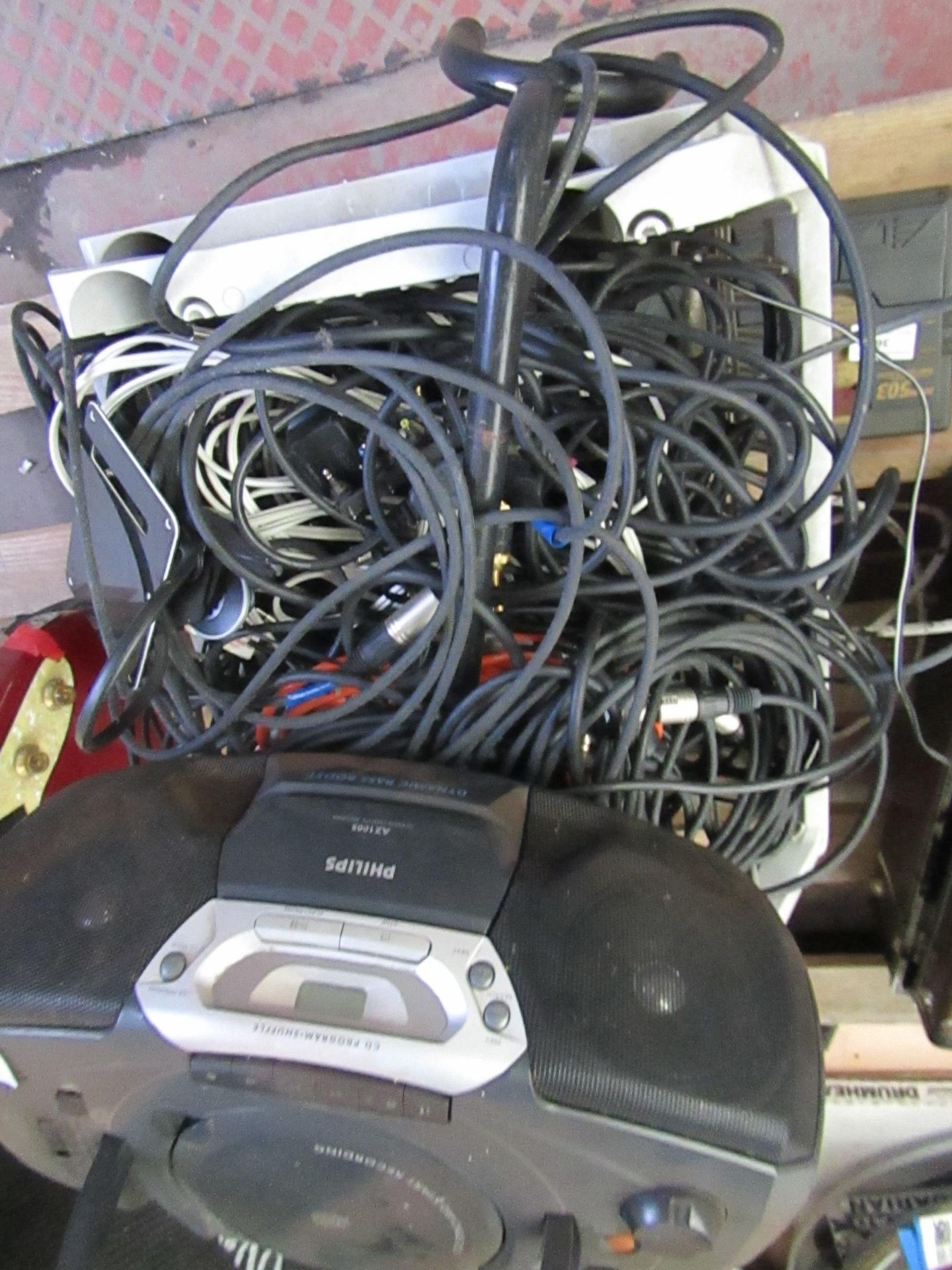 Plastic create full of cables and a Phillips Portable cd/radio, all unchecked. please read lot 0