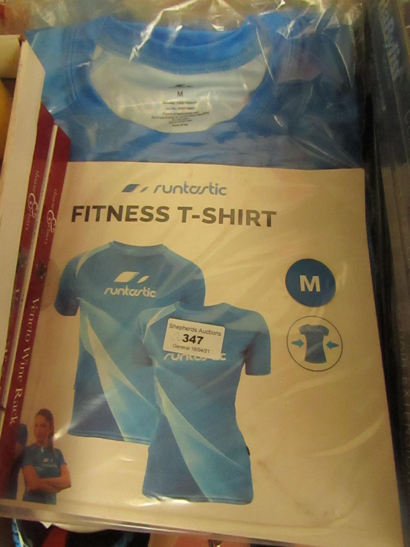 2x Runtastic fitness shirts, size M, new and packaged.