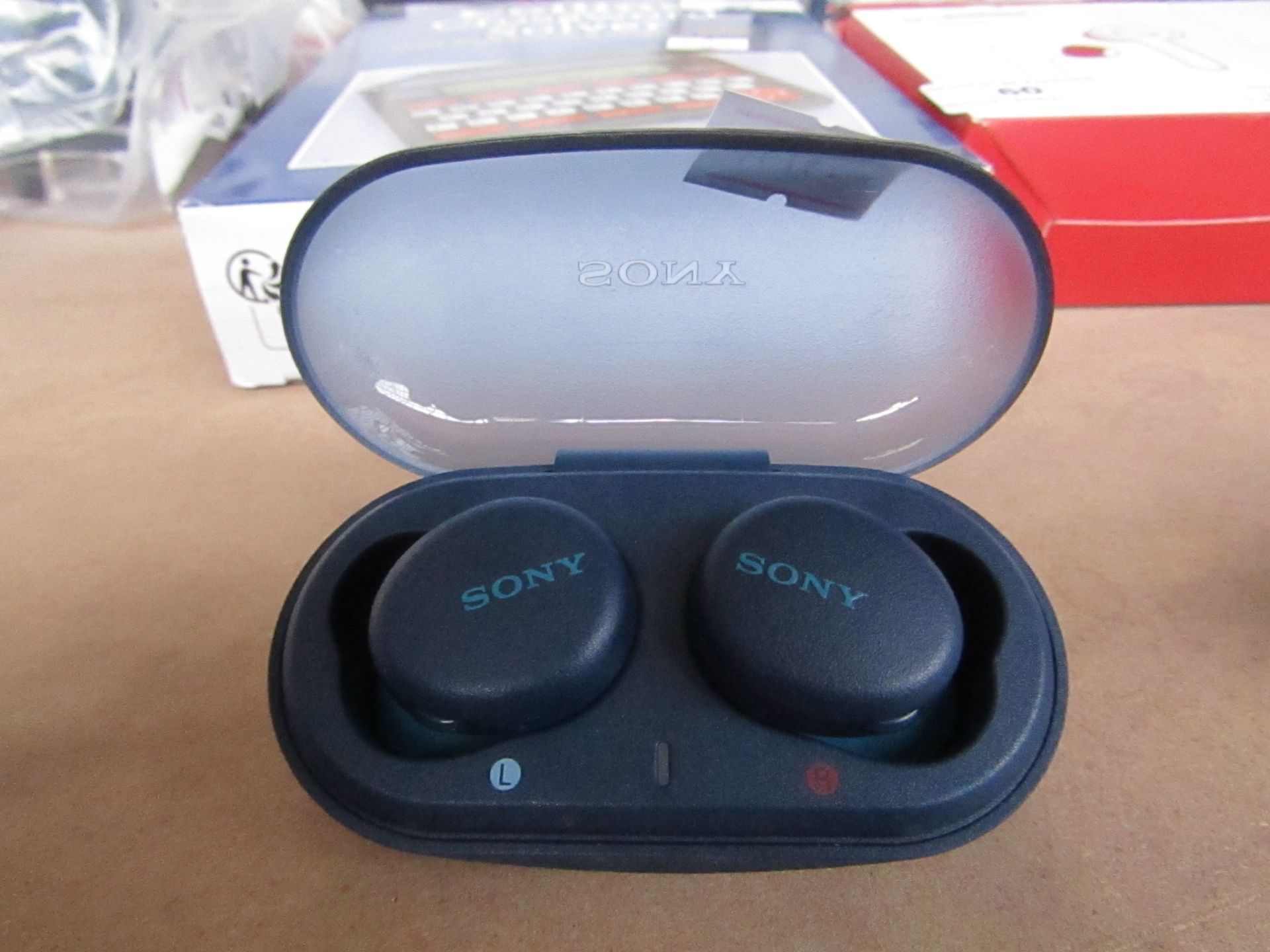Sony earbuds with case, unchecked.