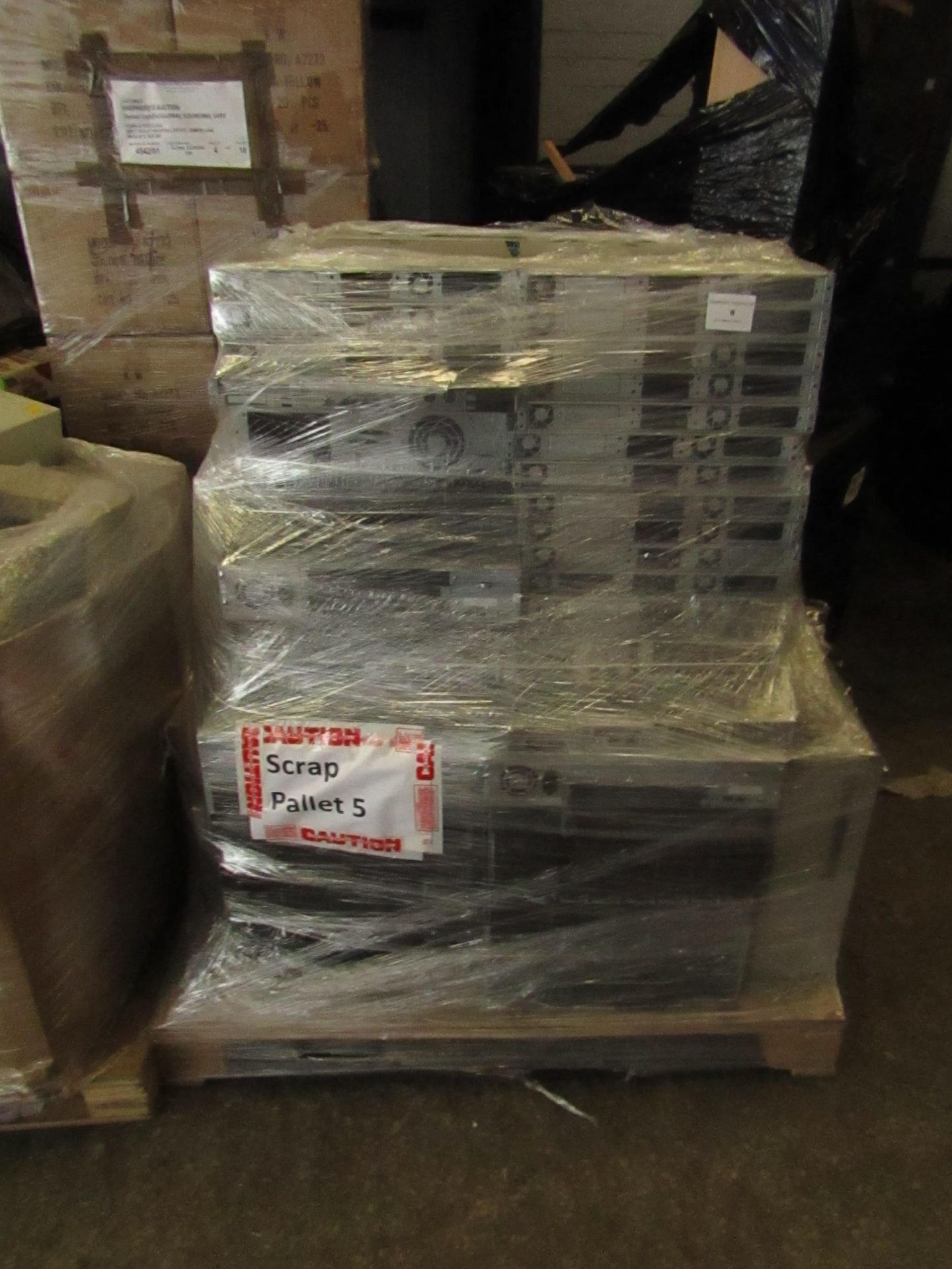 Pallet of what looks to be mainly Rack servers with the hard drives taken out, other items may be on