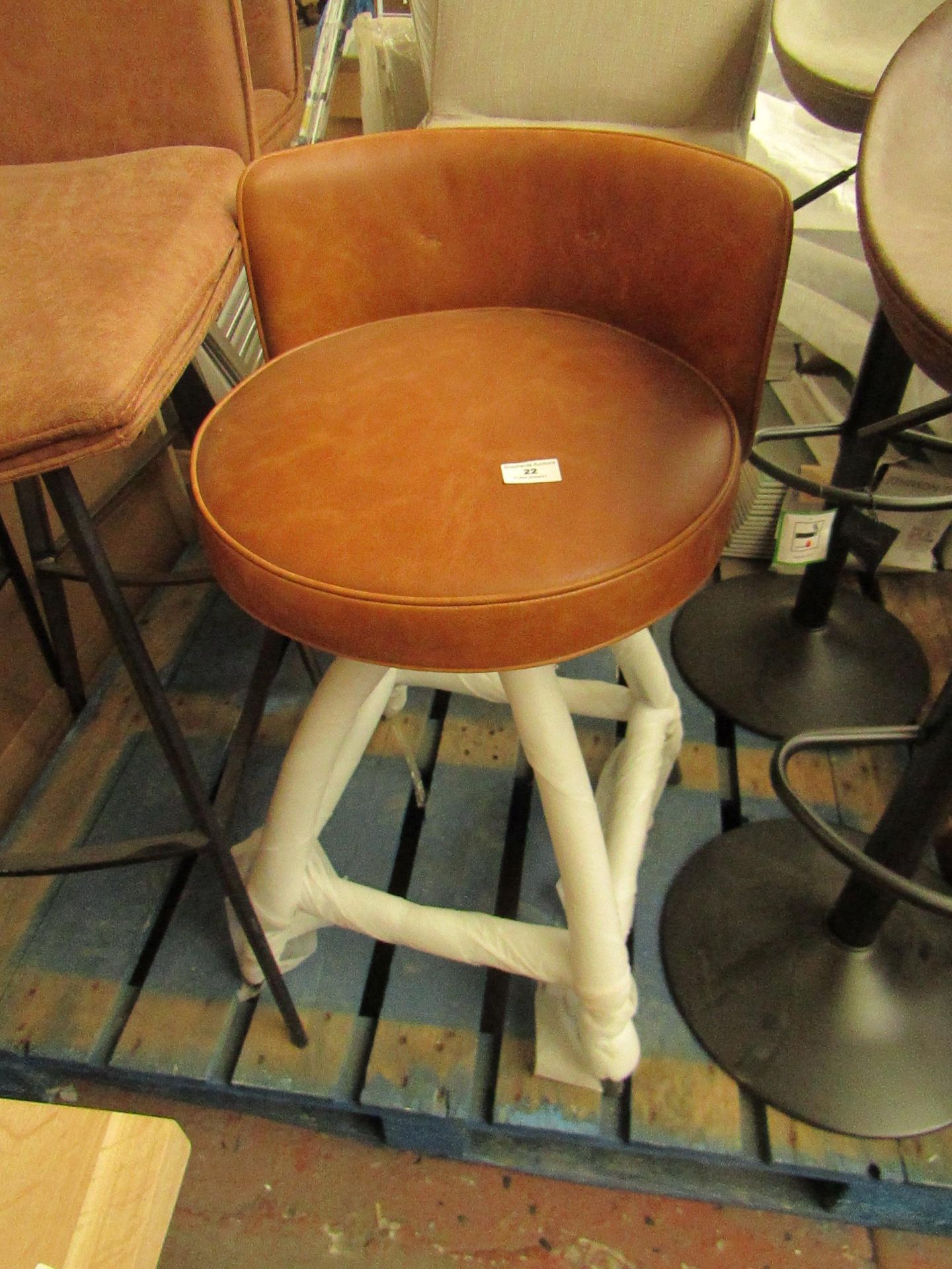 | 1X | CASS TWIST COUNTER STOOL - TAN | HAS 2 SMALL HOLE IN THE LEATHER | RRP £225 |