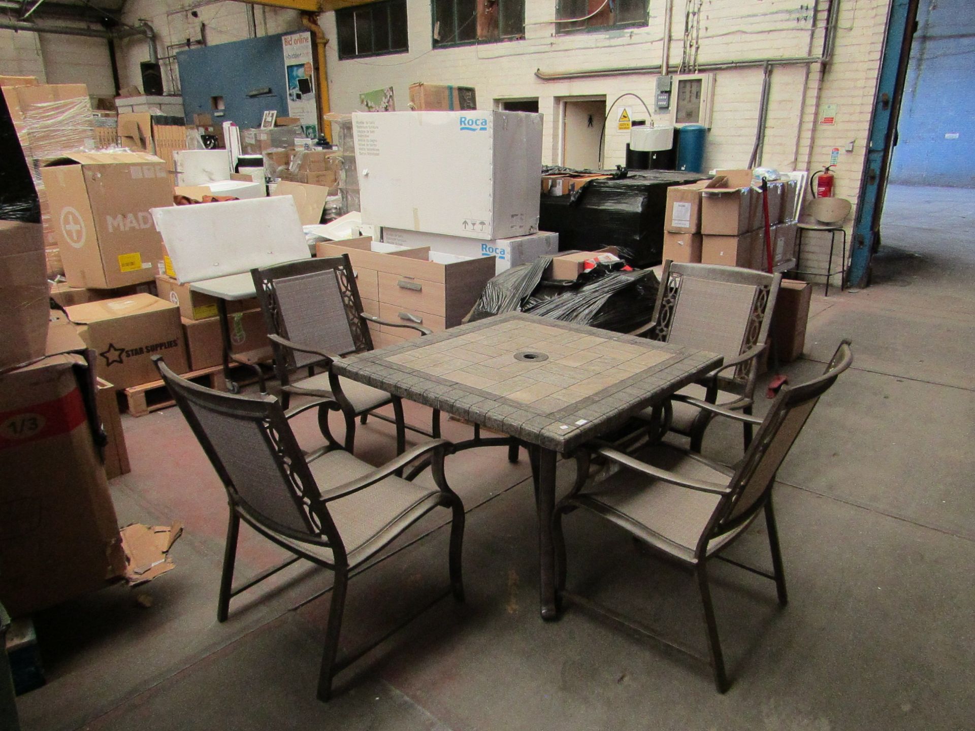 Costco stone tile topped outdoor dining table set with 4 chairs, the tile top has a few chips on the