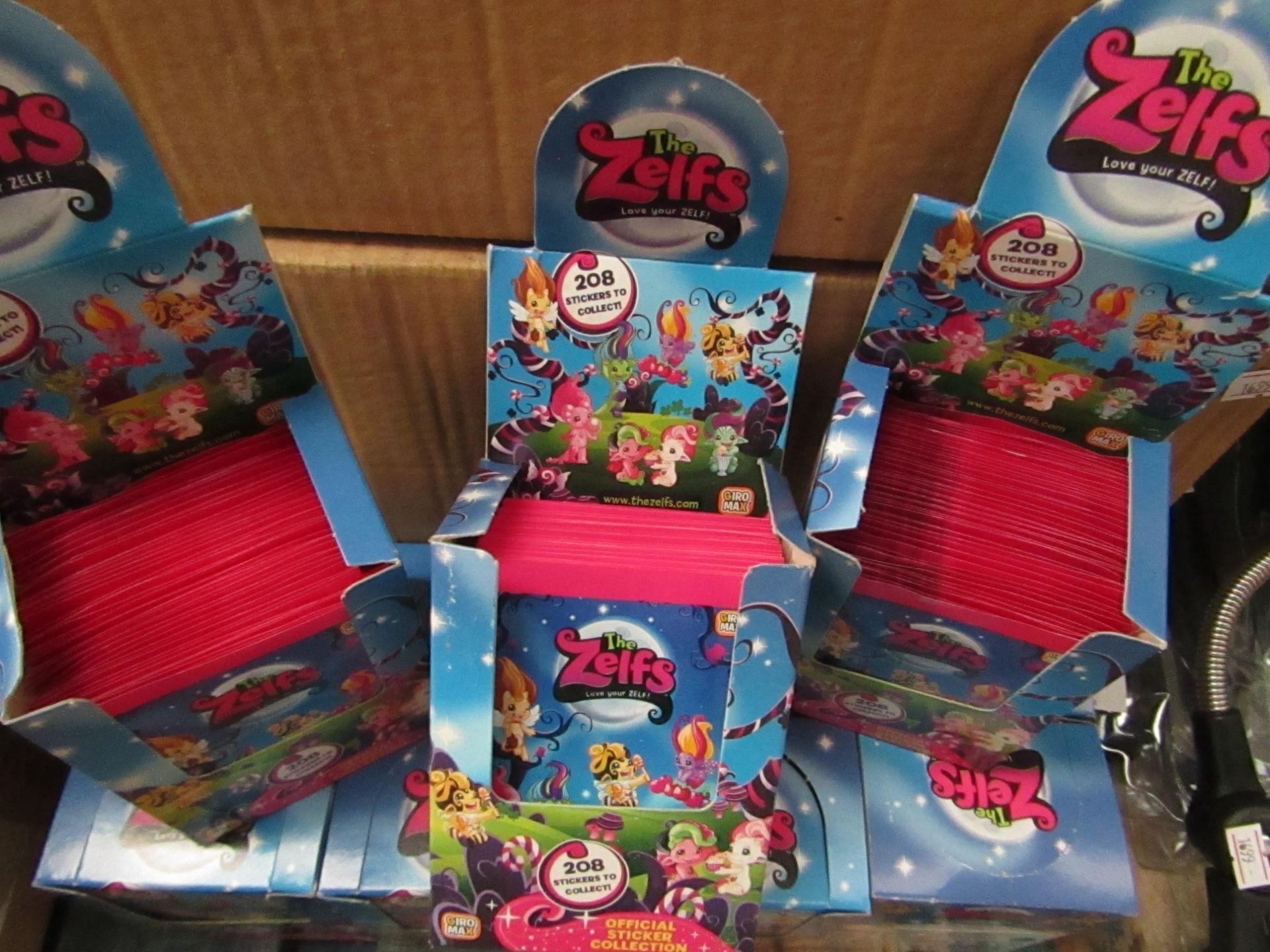 12x Boxes Containing 50 Units Per Box Being: The Zelfs - Official Sticker Collection - Unused &