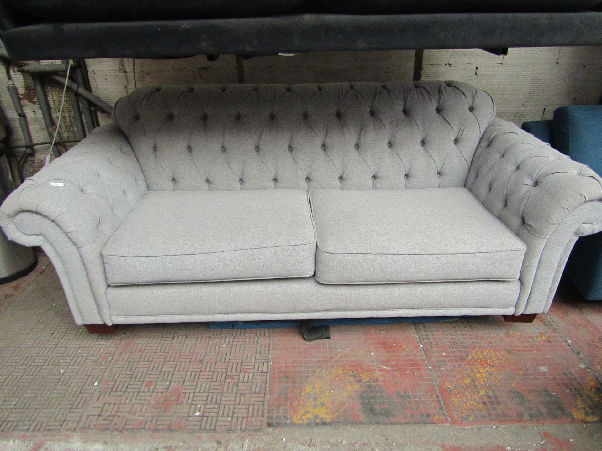 Costco 3 seater button back sofa, no major damage and includes feet.