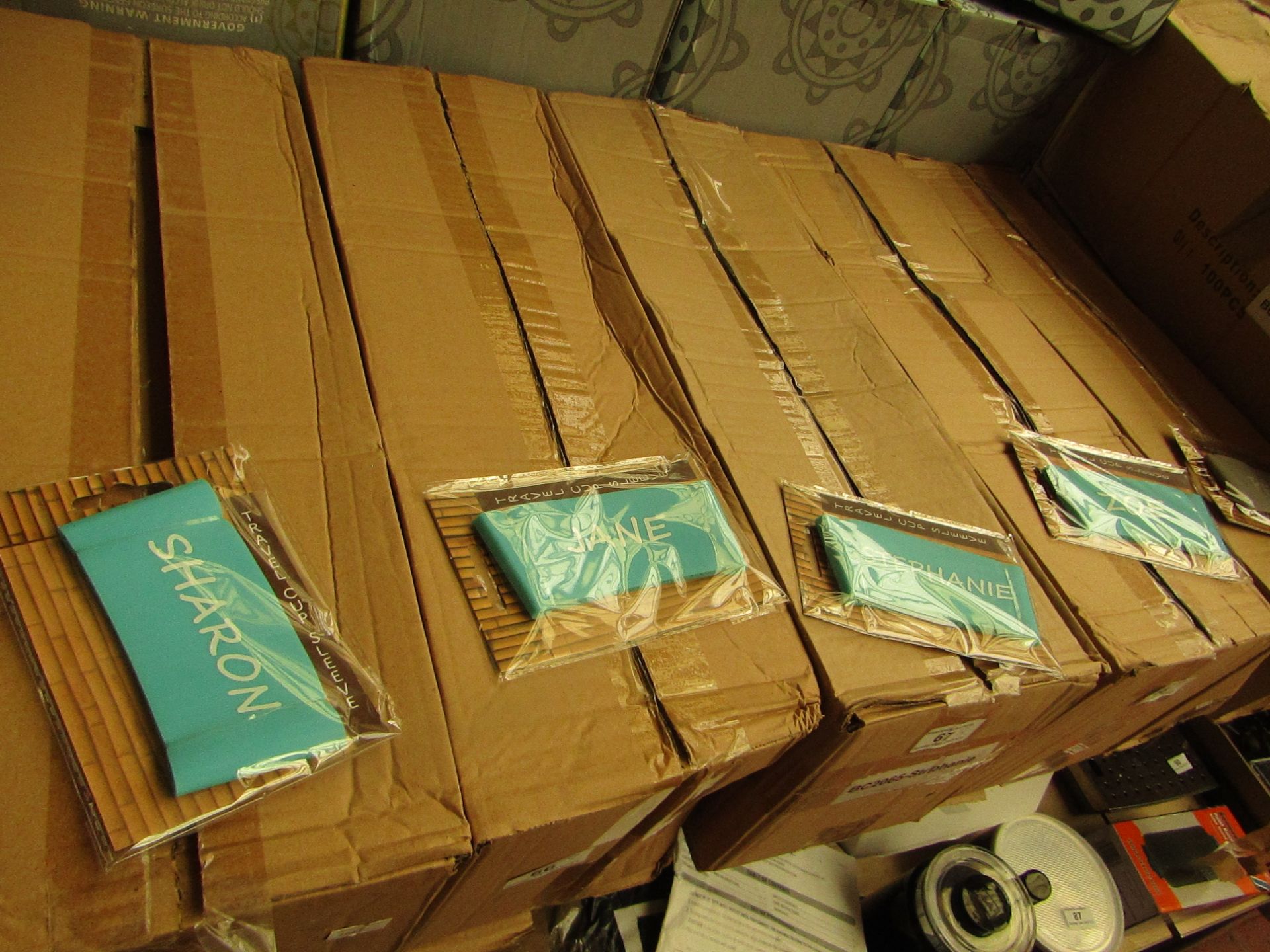 5x Boxes of 100 various named Travel Cup Sleeves - New & Packaged.