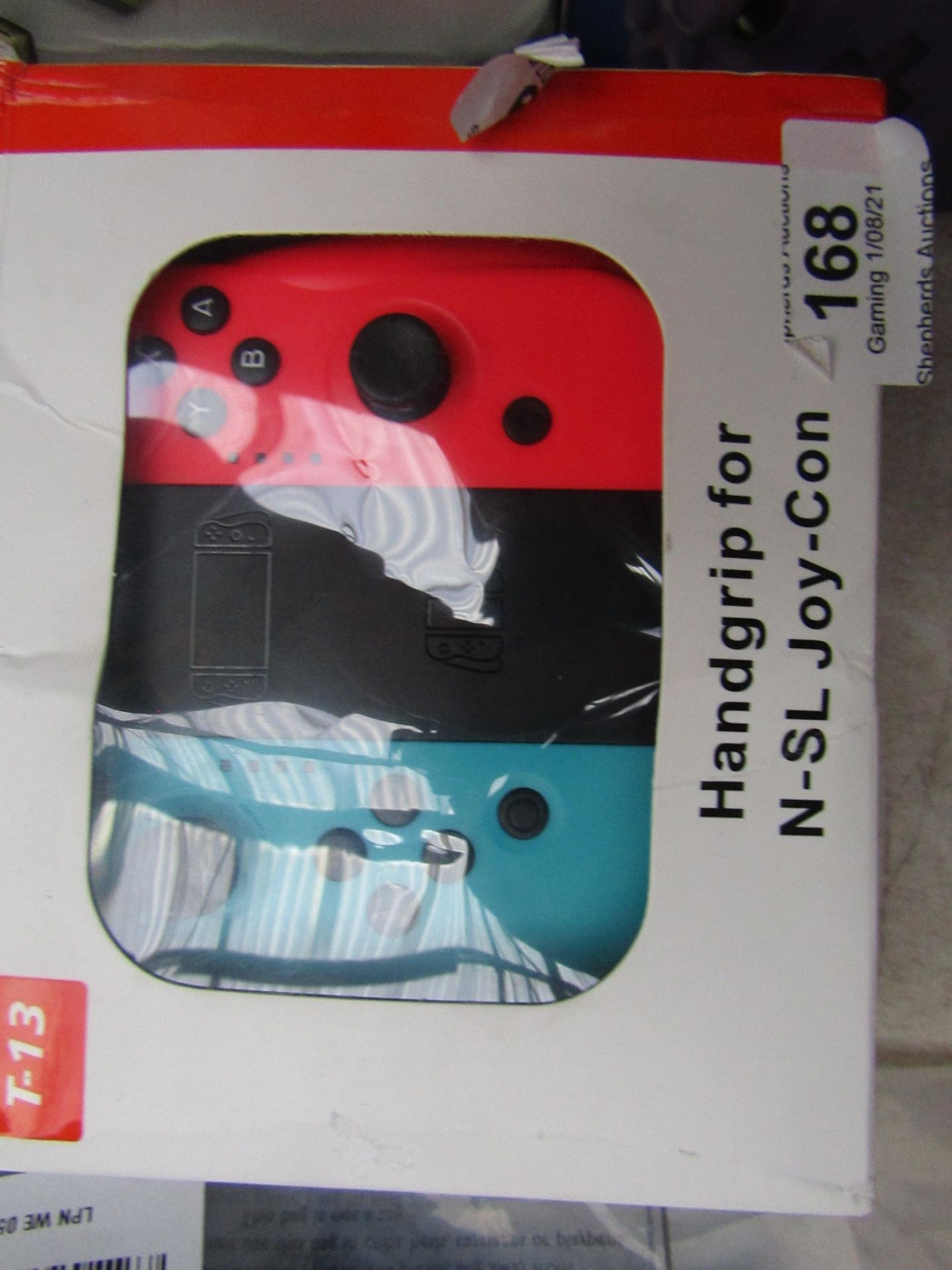 Handi grip controller frame and both side joy cons for a Nintendo switch, unchecked and boxed