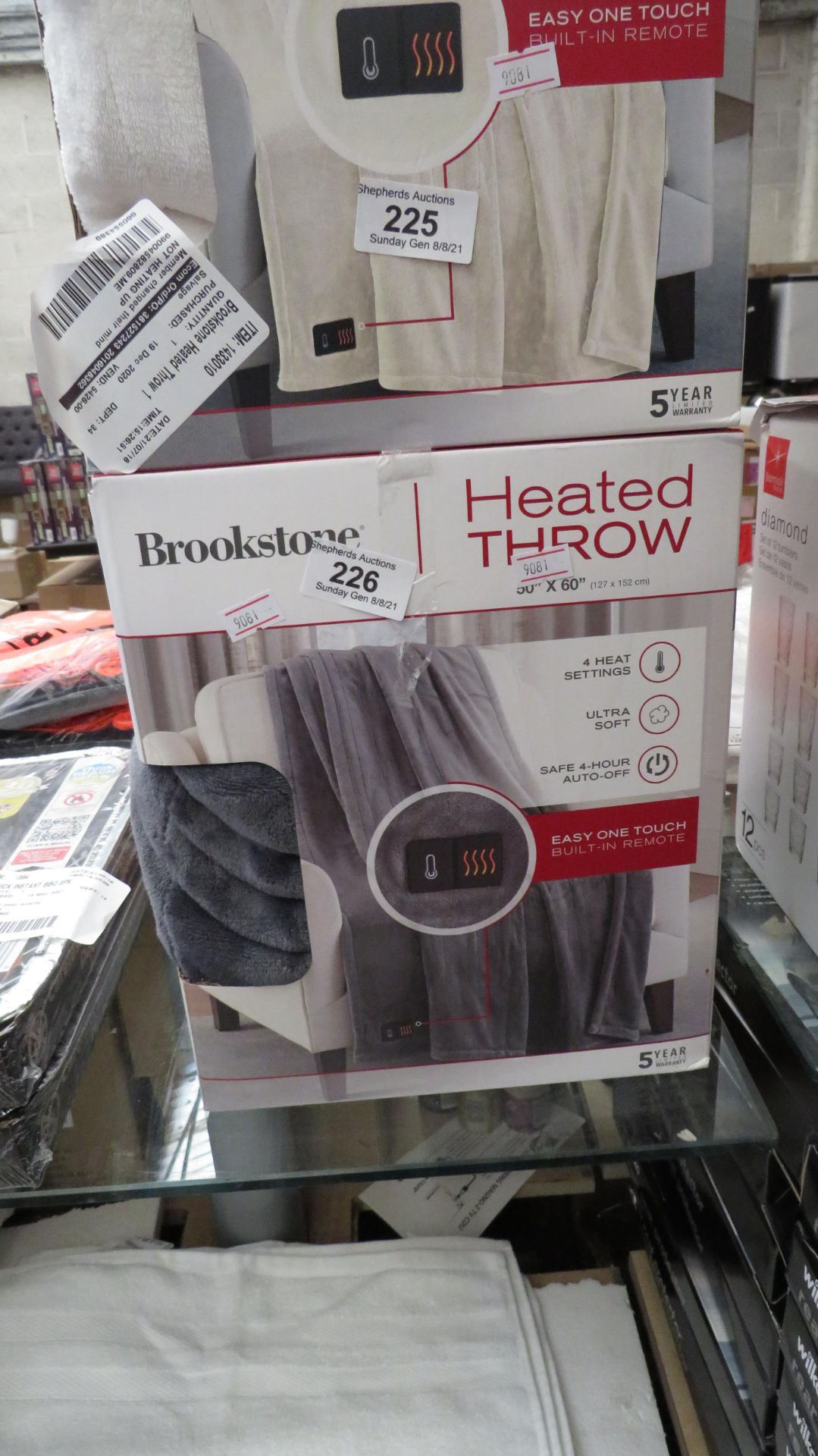 1X BROOKSTONE HEATED THROW, GREY, UNCHECKED IN BOX.