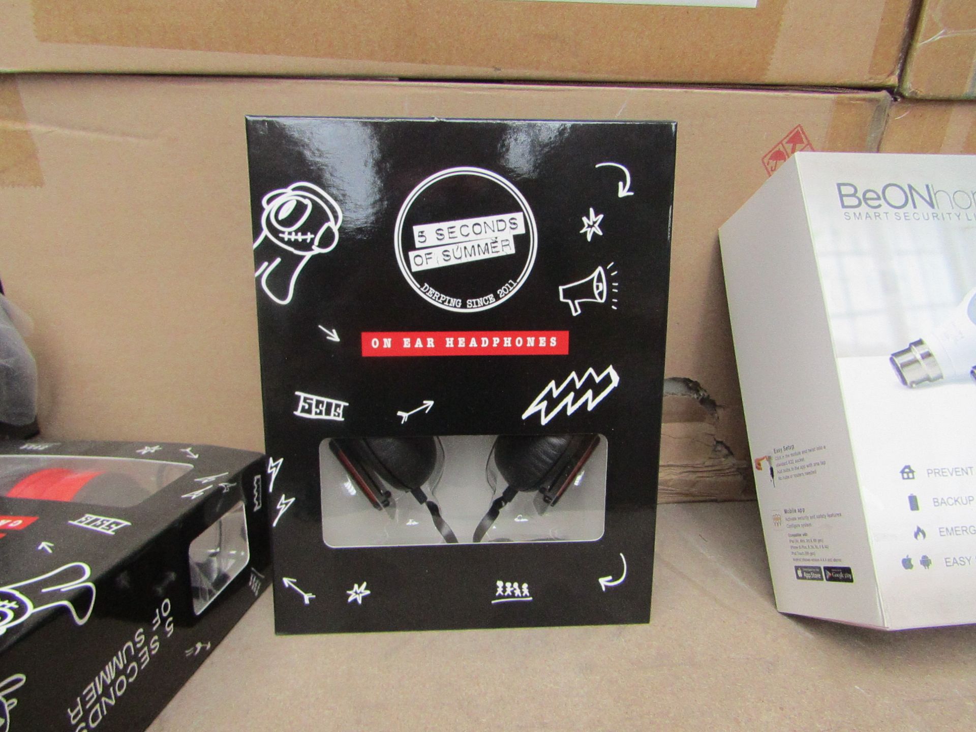 12x 5 Secondds of Summer branded on ear headphones, new and packaged.