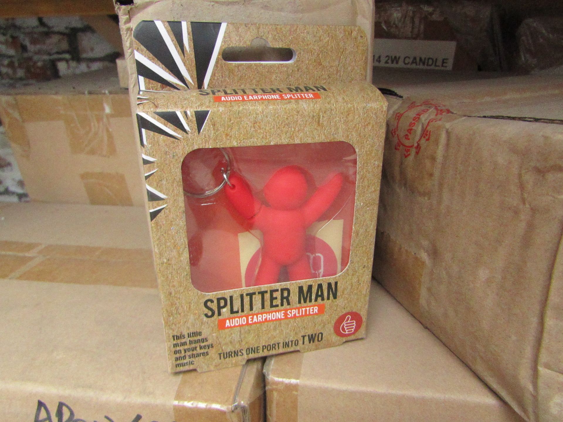 12x Splitter man key rings, allows sound sharing of a device to wired headphones, all new and boxed