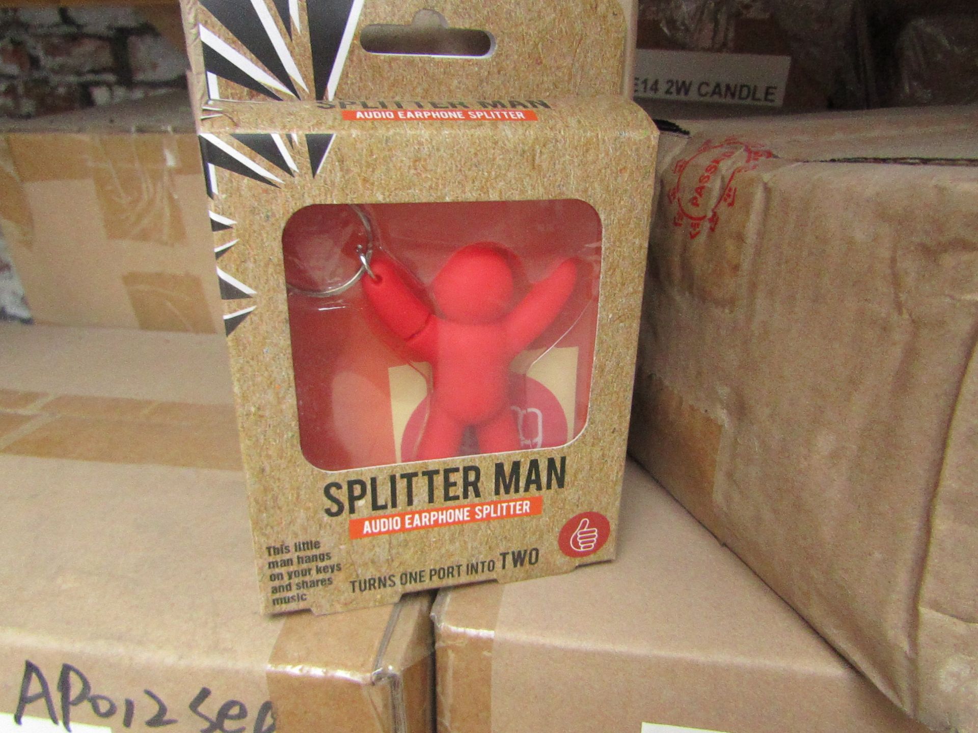 12x Splitter man key rings, allows sound sharing of a device to wired headphones, all new and boxed