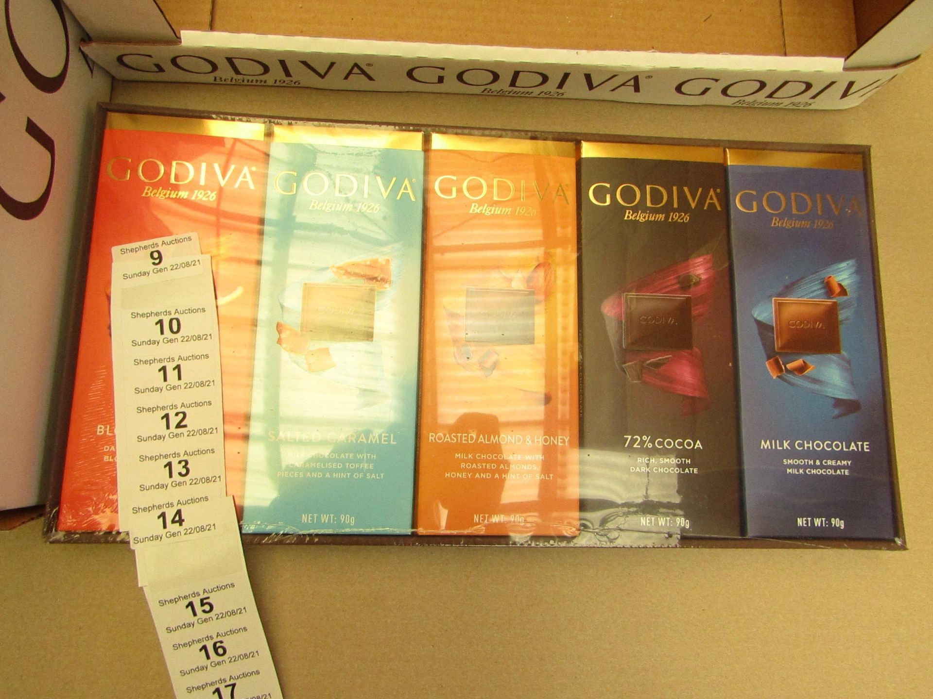 1X BOX CONTAINING 10 GODIVA CHOCOLATE BARS BLOOD ORANGE & SALTED CARAMEL & ROASTED ALMOND & 72%