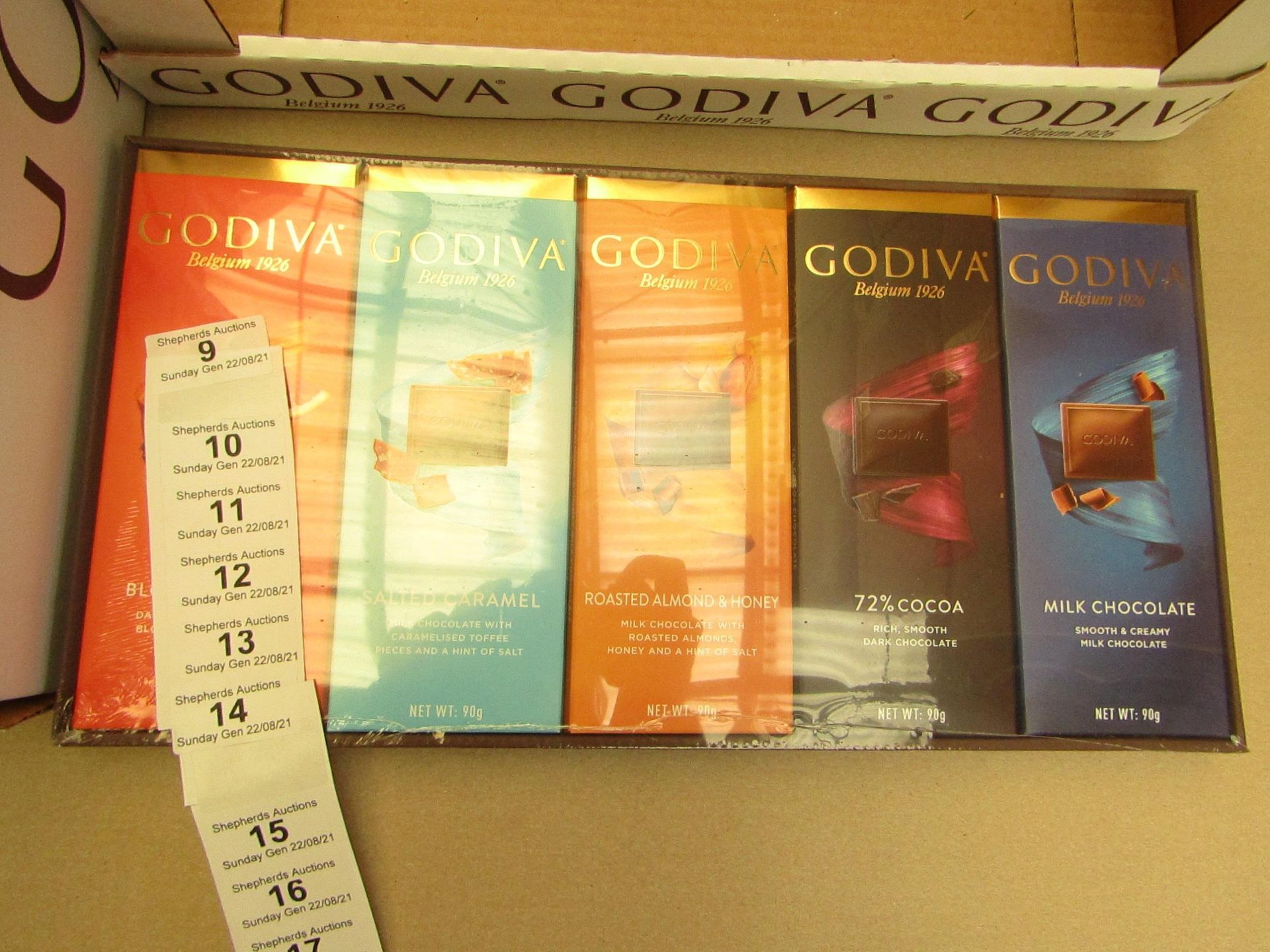 1X BOX CONTAINING 10 GODIVA CHOCOLATE BARS BLOOD ORANGE & SALTED CARAMEL & ROASTED ALMOND & 72%