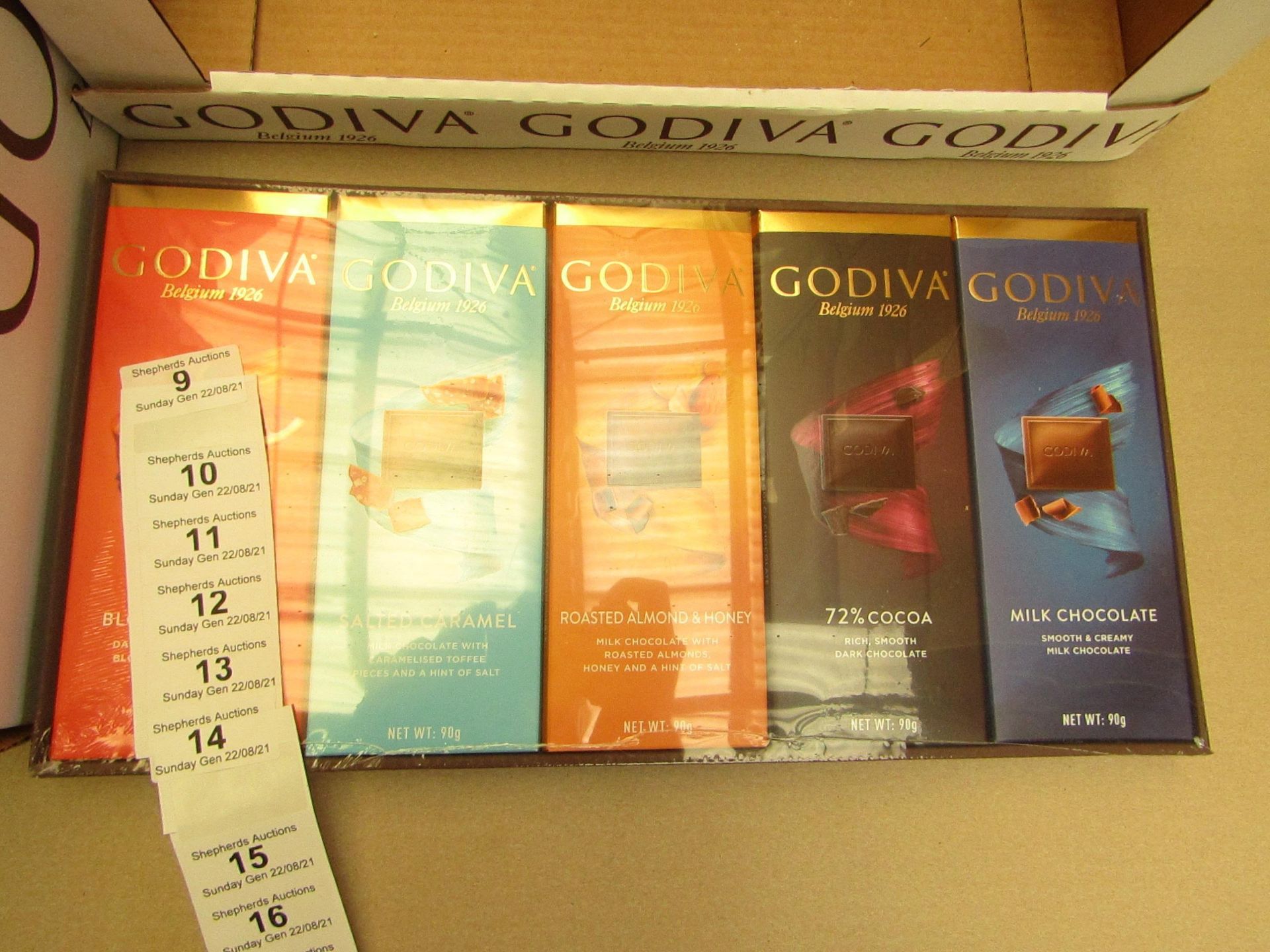 1X BOX CONTAINING 10 GODIVA CHOCOLATE BARS BLOOD ORANGE & SALTED CARAMEL & ROASTED ALMOND & 72%