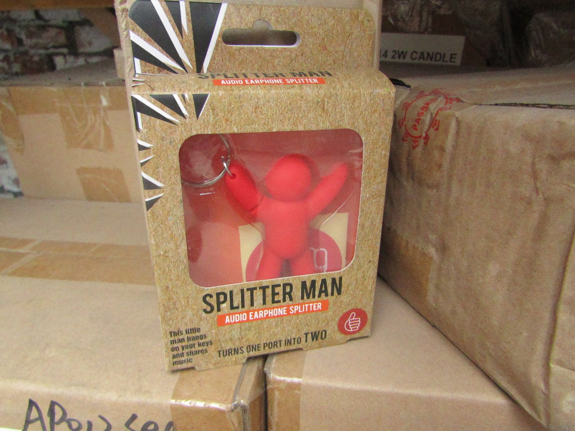 12x Splitter man key rings, allows sound sharing of a device to wired headphones, all new and boxed