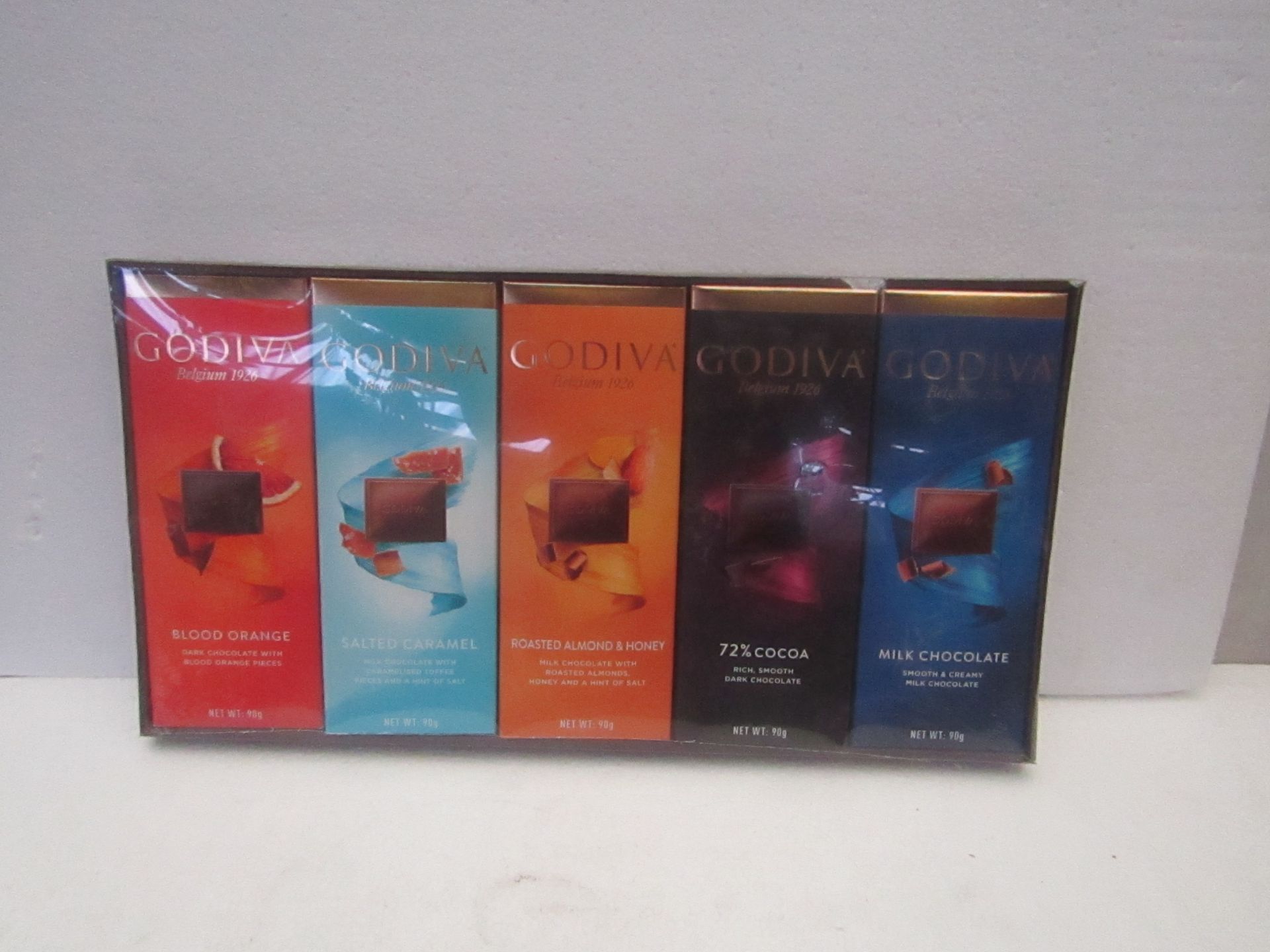 1X BOX CONTAINING 10 GODIVA CHOCOLATE BARS BLOOD ORANGE & SALTED CARAMEL & ROASTED ALMOND & 72%