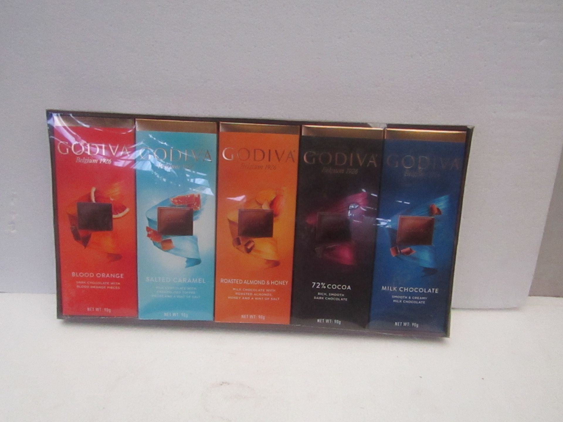 1X BOX CONTAINING 10 GODIVA CHOCOLATE BARS BLOOD ORANGE & SALTED CARAMEL & ROASTED ALMOND & 72%