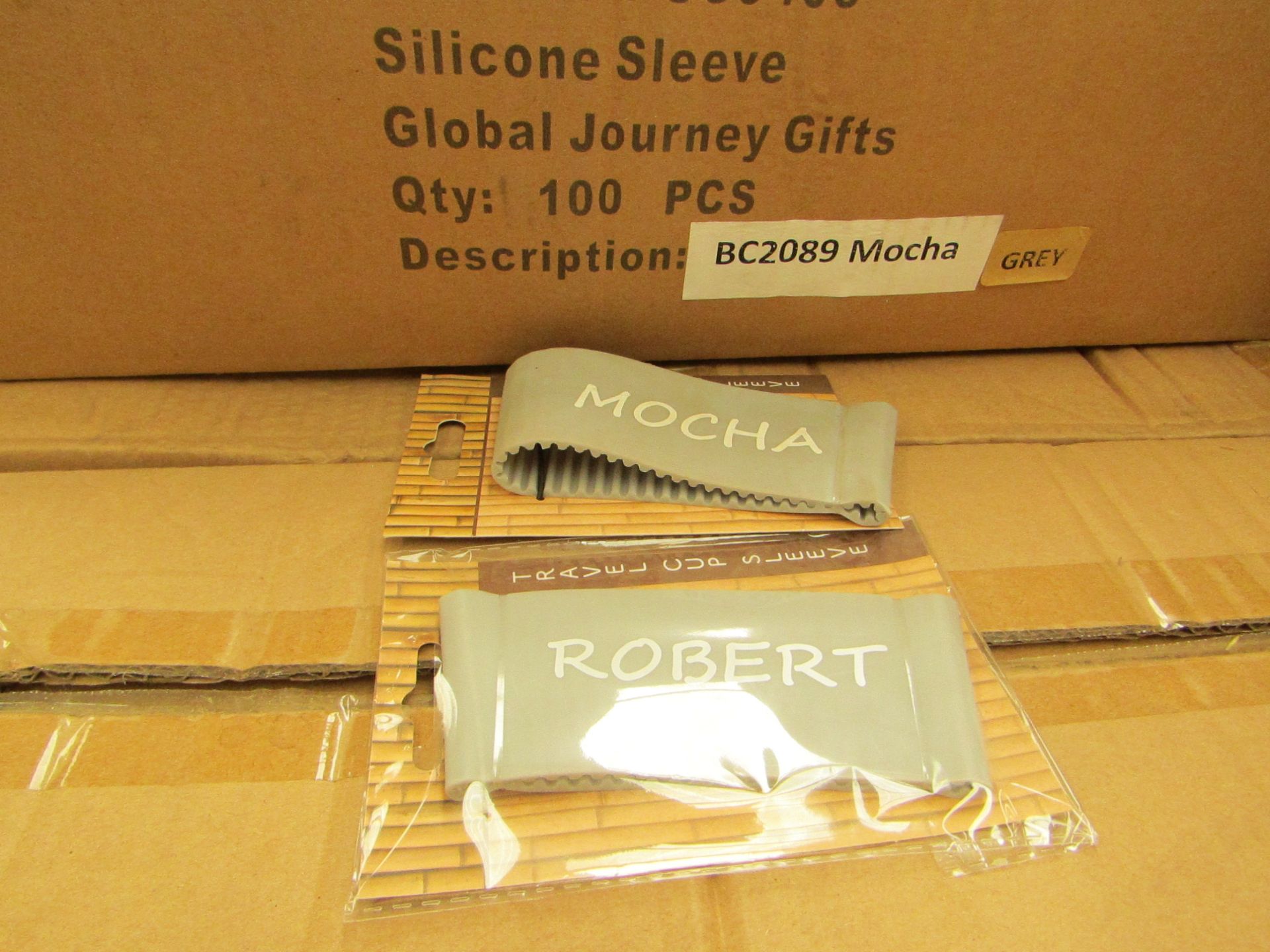 10x Boxes each Containing 100 Units of Silicone Cup Sleeve's (Grey) with various themes such as