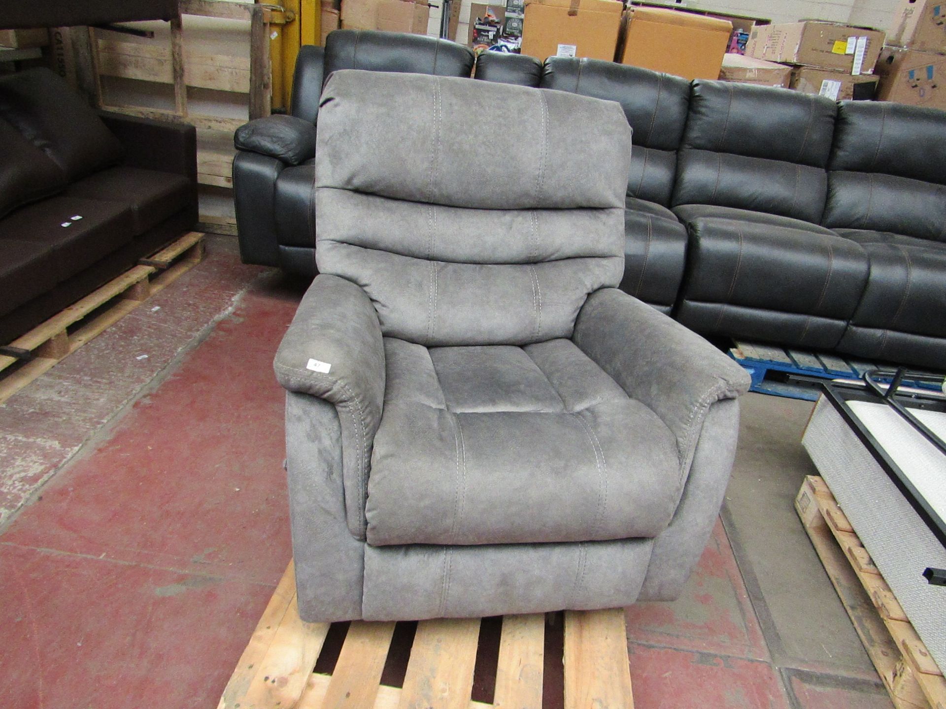 Costco leather swivel and recliner armchair, no major damage but has blue marks on the right arm.