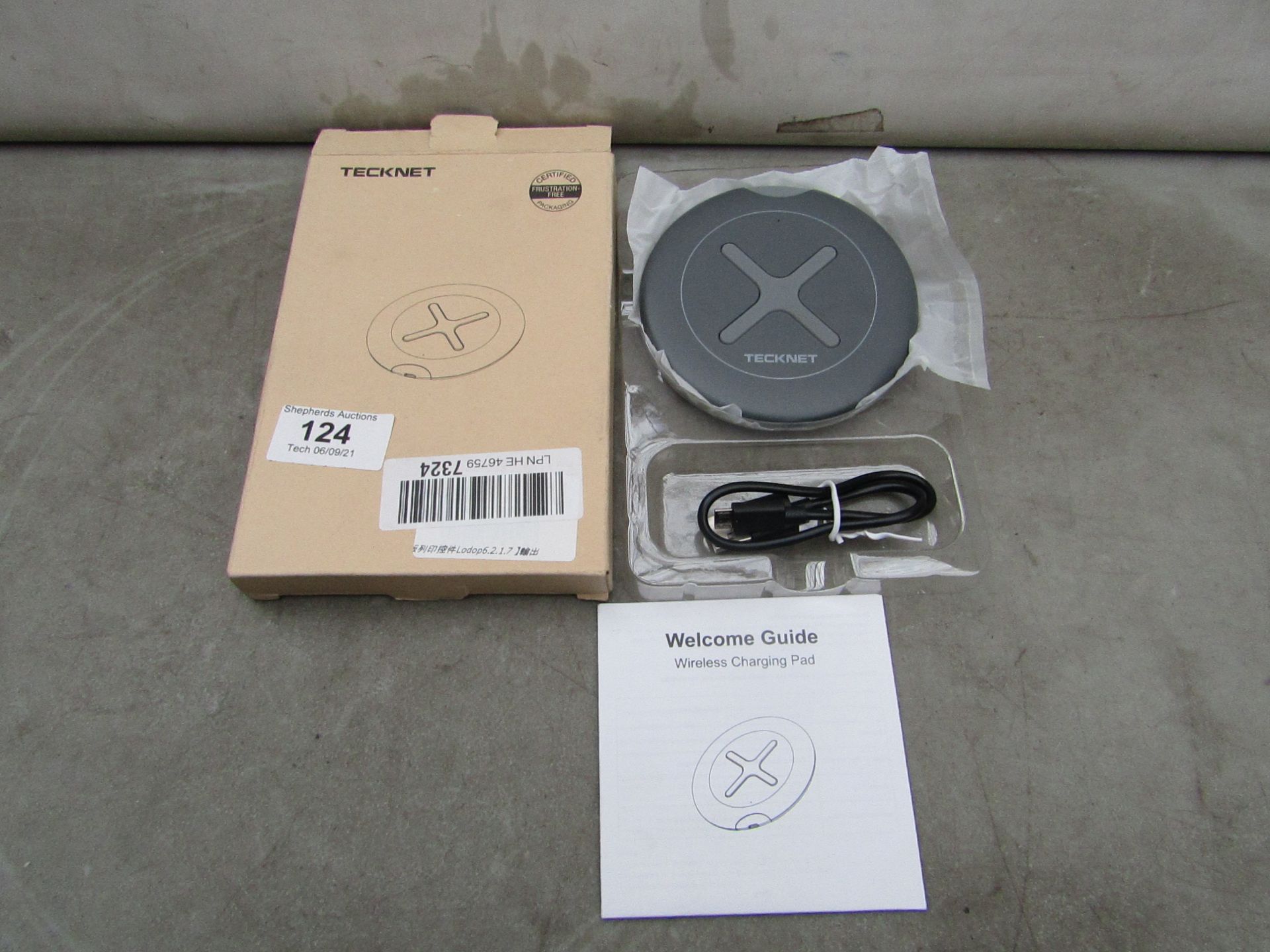 Tecknet wireless charging pad, new and boxed.
