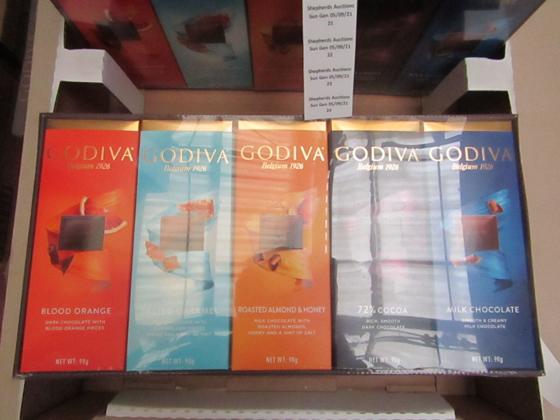 1X BOX CONTAINING 10 GODIVA CHOCOLATE BARS BLOOD ORANGE & SALTED CARAMEL & ROASTED ALMOND & 72%