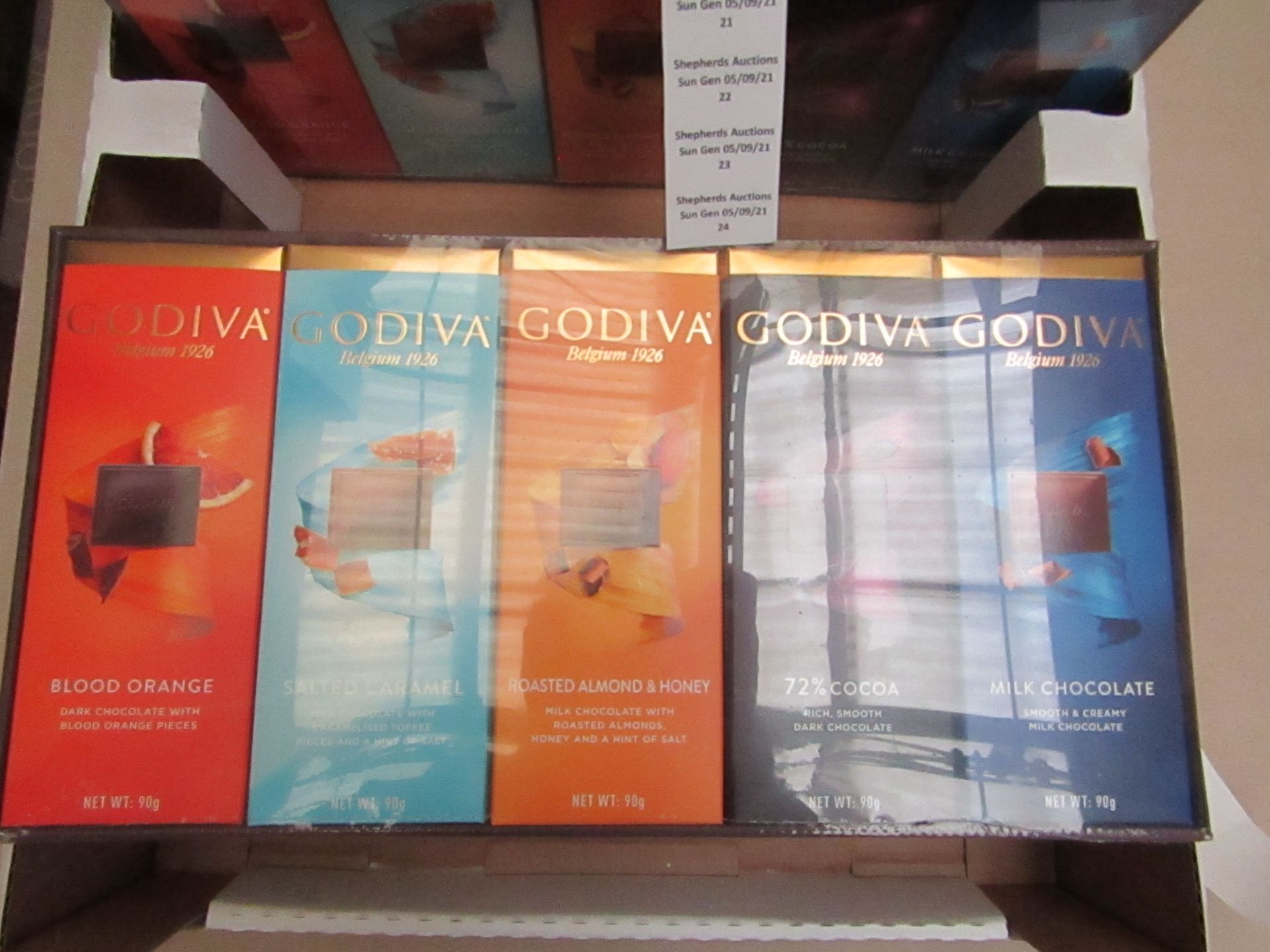 1X BOX CONTAINING 10 GODIVA CHOCOLATE BARS BLOOD ORANGE & SALTED CARAMEL & ROASTED ALMOND & 72%