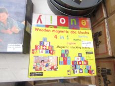 1x wooden magnetic abc blocks - looks unused & still has packaging.