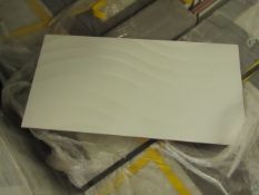 1x pallet of 18 packs of 12x white satin ceramic wall tiles, mixed styles, some may be cracked and