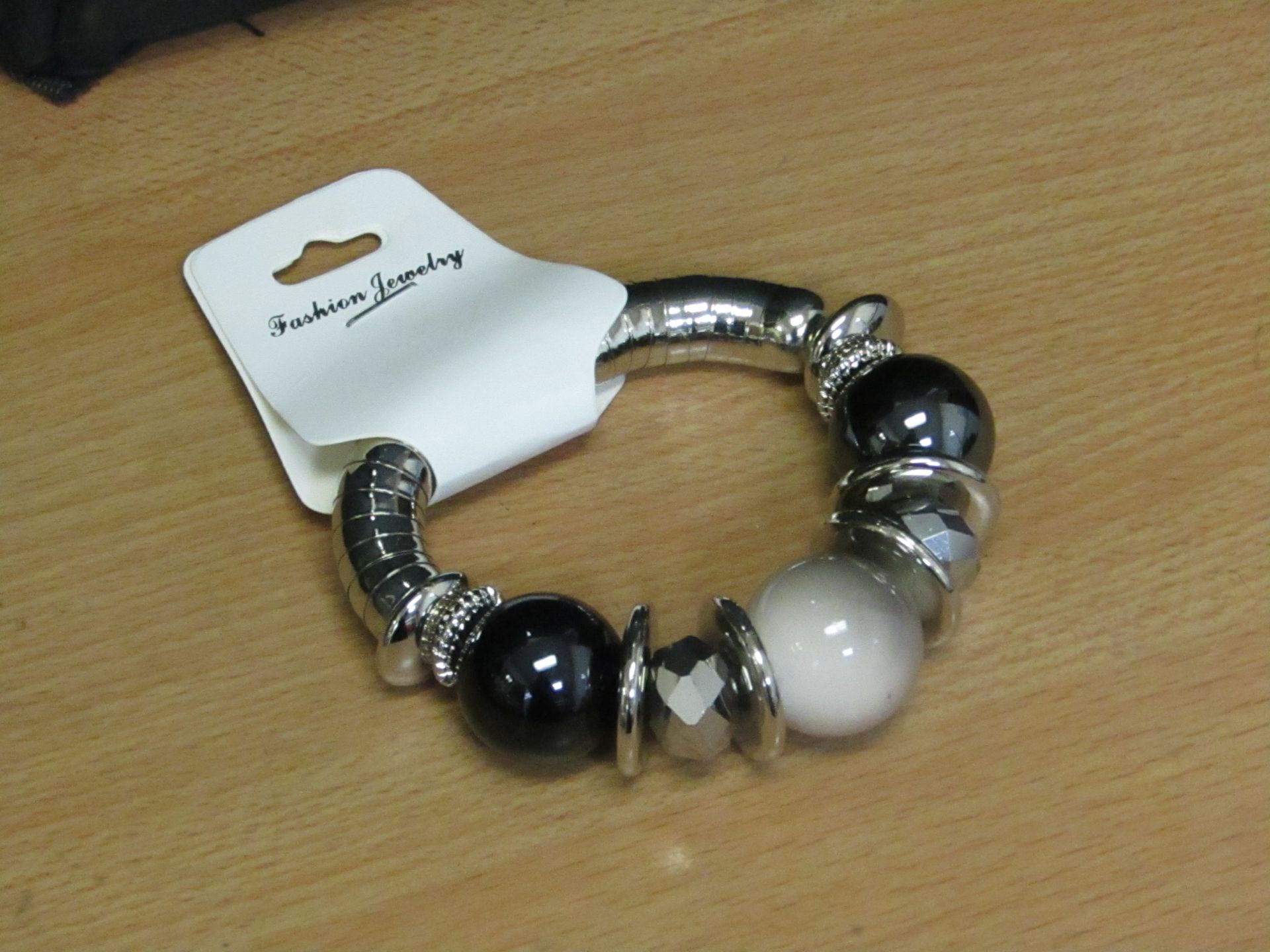 5x Womens dress bracelet - new & packaged.