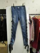 Unbranded ladies jeans with tied ribbon sides, size 8, ribbbon looks damaged on one side.