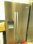 Hisense American fridge freezer with water dispenser, clean inside, has dents on the doors,