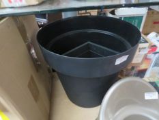 Large black plastic plant pot, unused.