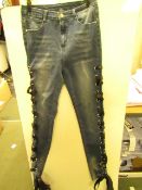 Unbranded ladies jeans with tied ribbon sides, size 8, ribbbon looks damaged on one side.