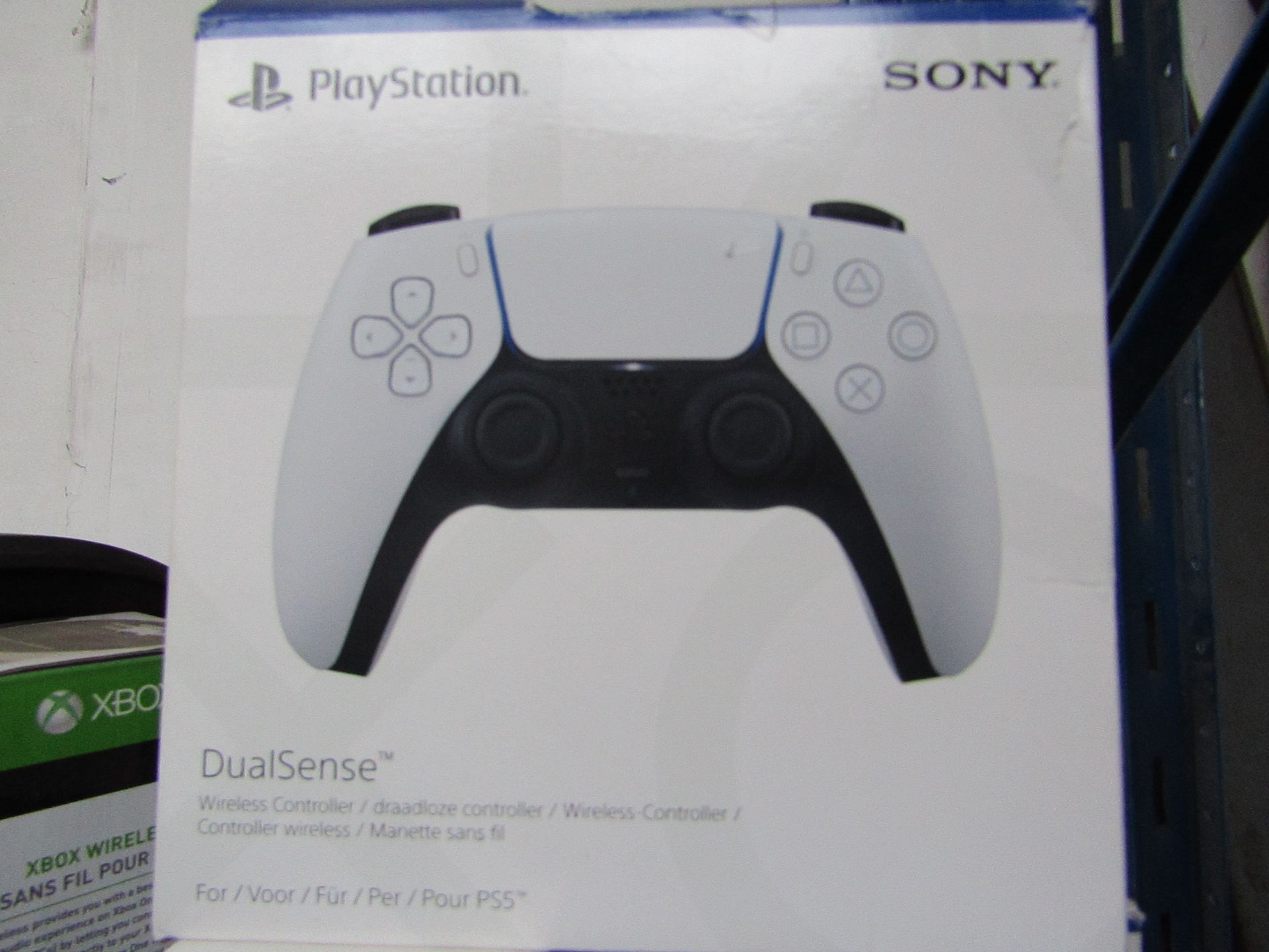 Play station 5 controller, working but has a loose button, in original box