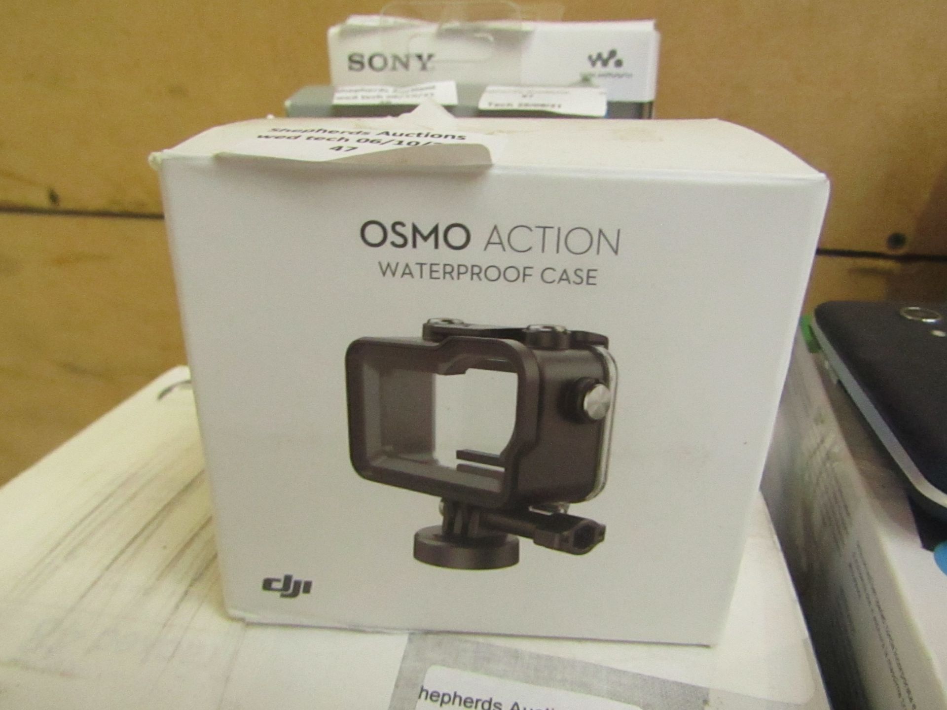 DJI osmo action water proof case, unchecked and boxed