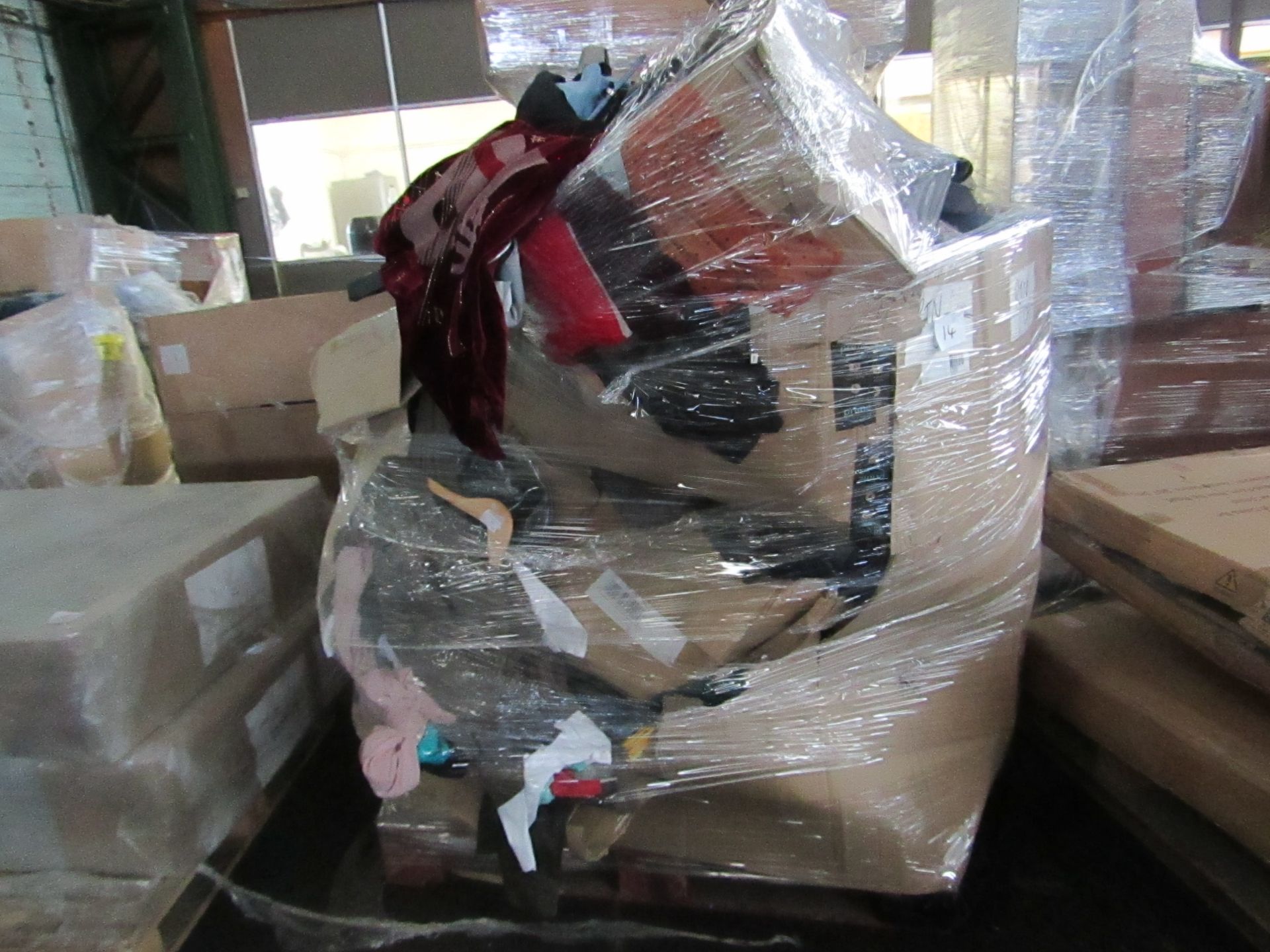 PALLET CONTAING LOTS OF CLOTHING ITEMS AND MISC ITEMS. ALL UNCHECKED