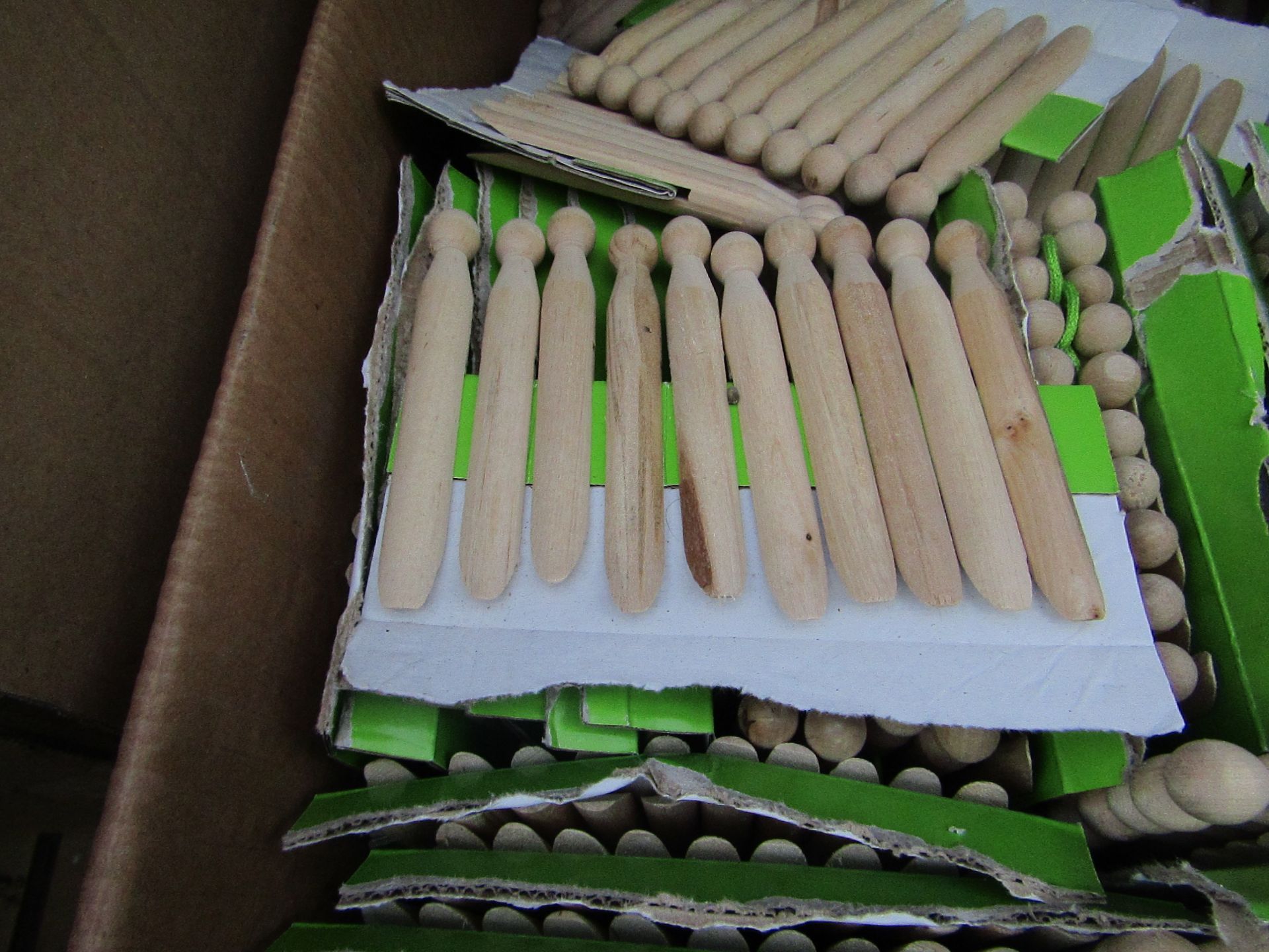 20x packs of 10 wooden pegs - unused.