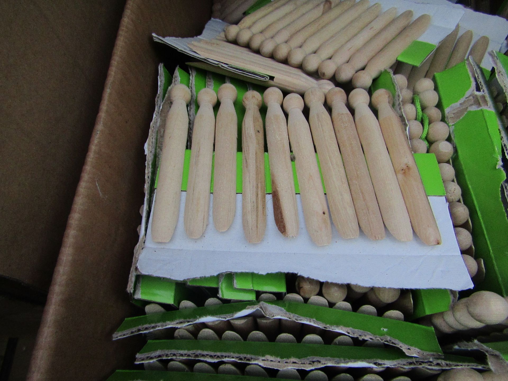 20x packs of 10 wooden pegs - unused.