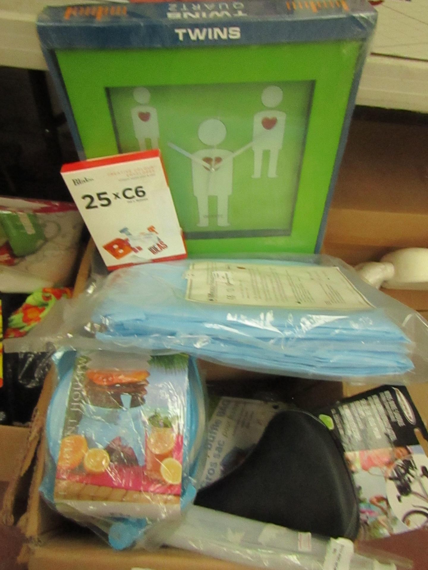 Box Containing Approx 10 Items Being : Replacement Bike Seat / Stamps / Isolation Gowns Etc.