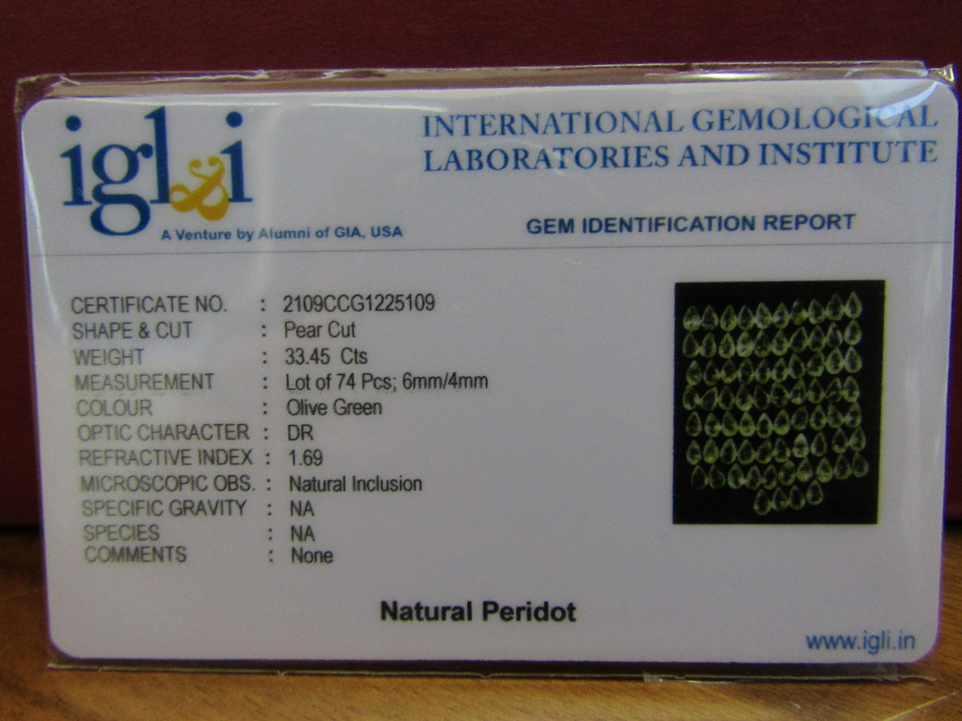 IGL&I Certified - Natural Peridot - 33.45 Carats - 74 Pieces - Pear Cut - Average retail value £11, - Image 2 of 3