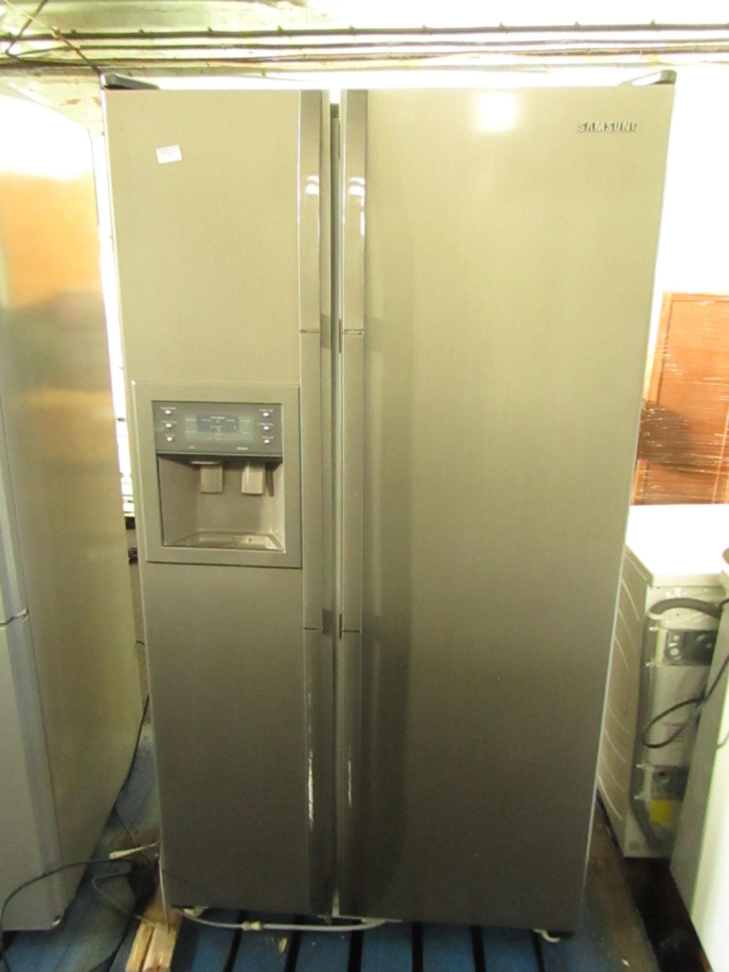 Samsung RS21DCMS American Fridge freezer with water and ice dispenser, has a few marks on the