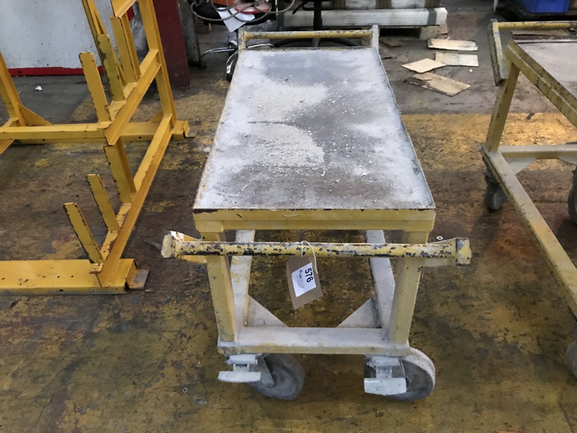 Yellow steel fabricated product trolley on casters